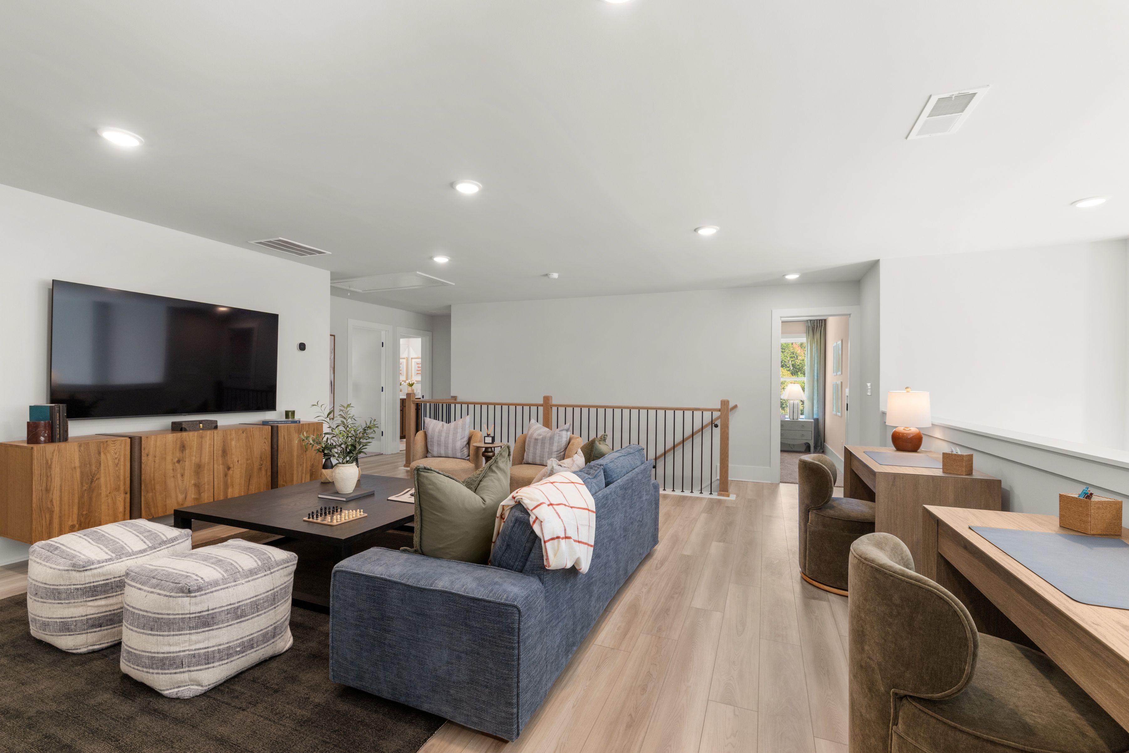 A living room with a tv and couches.