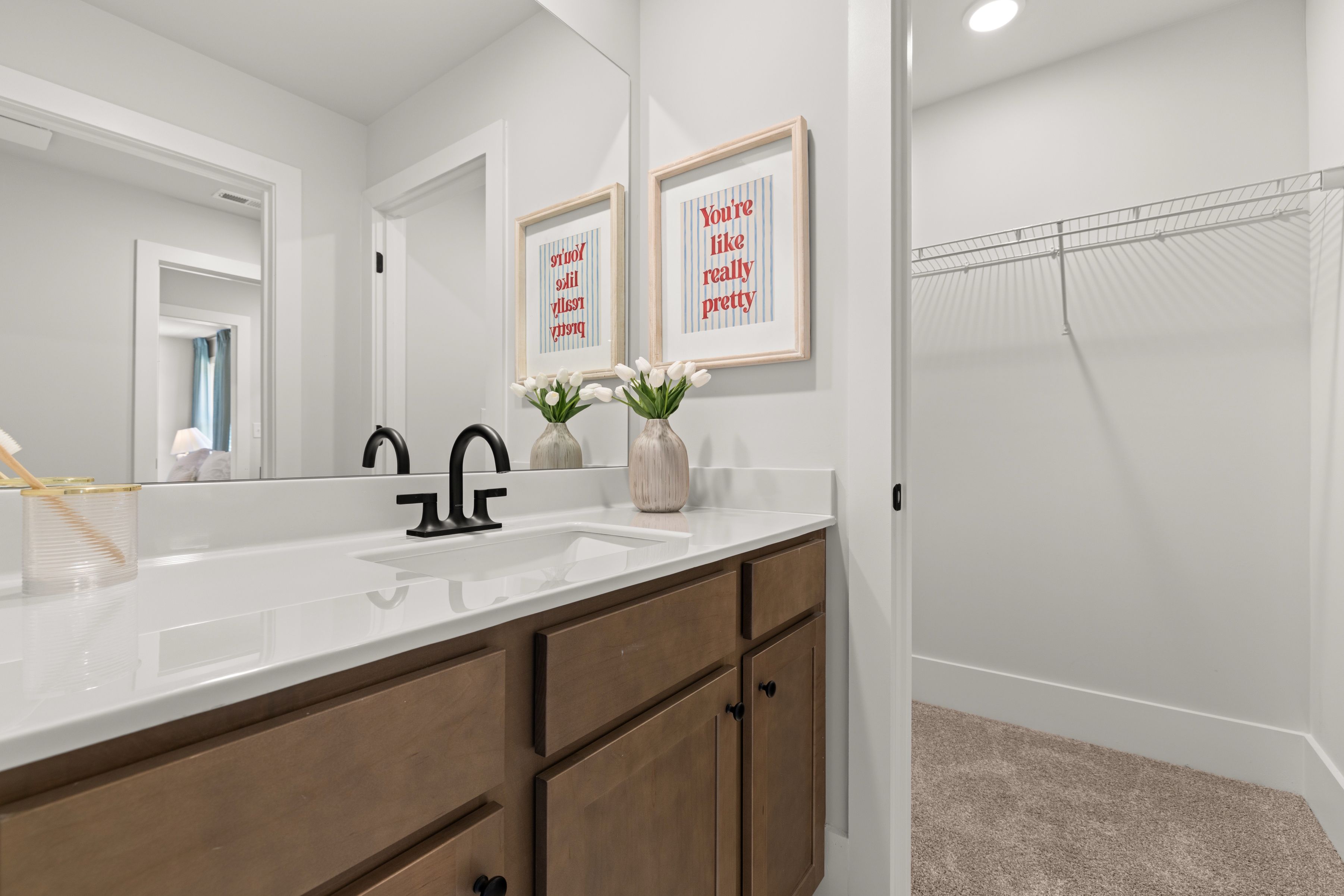 A bathroom with a sink and a shower.