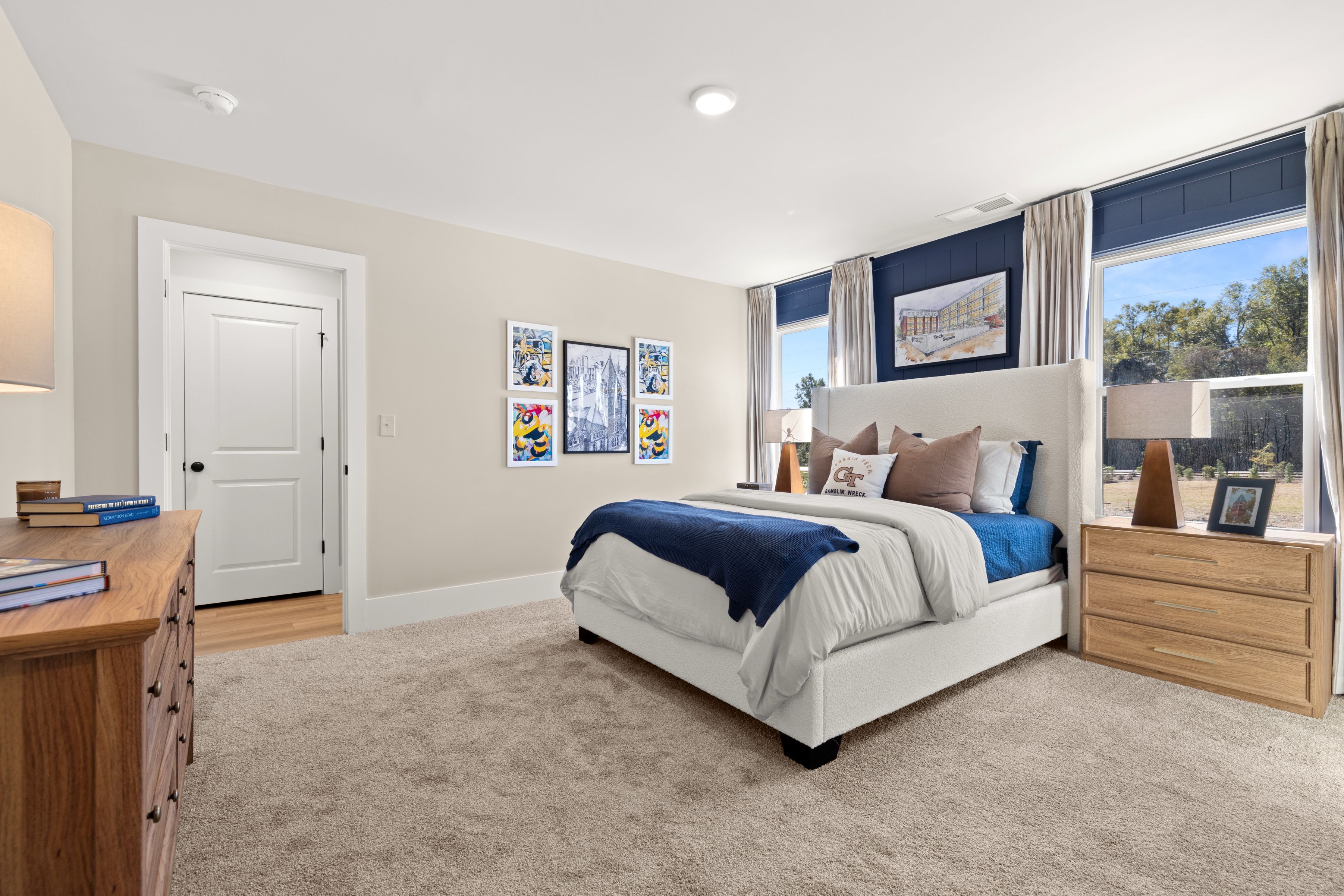 A bedroom with a bed and a window.