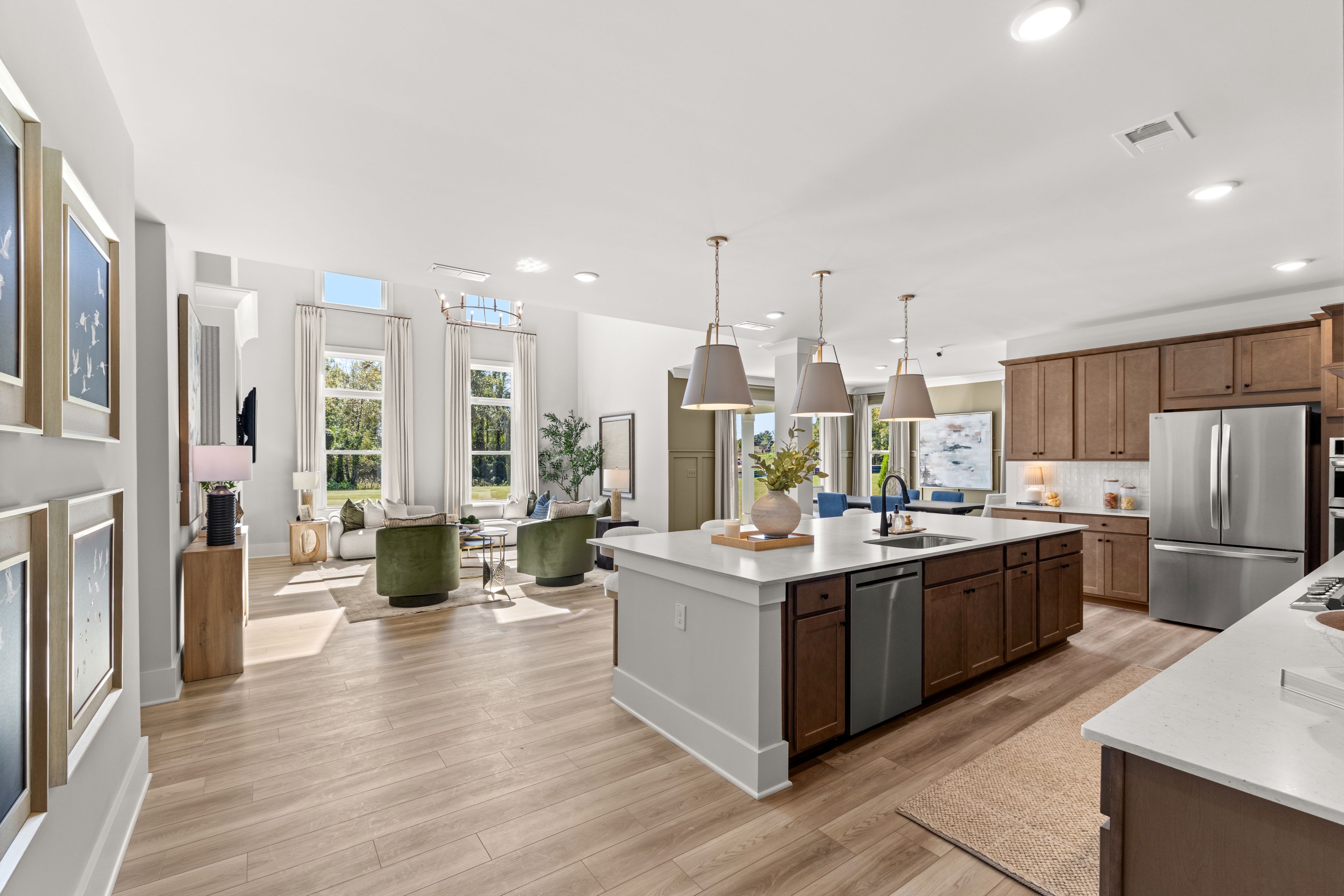 A kitchen with a wood floor.