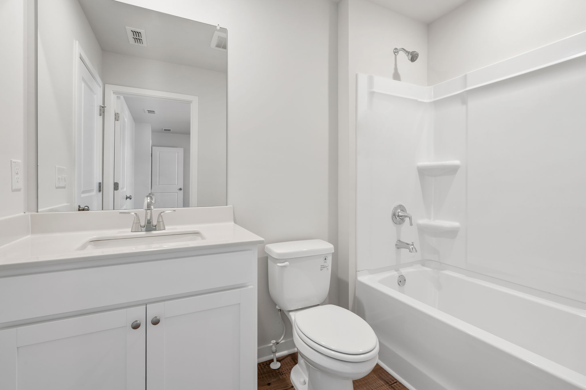 A bathroom with a toilet and sink.