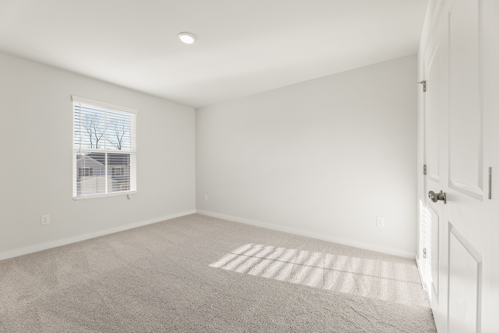 A room with a rug and a rug.