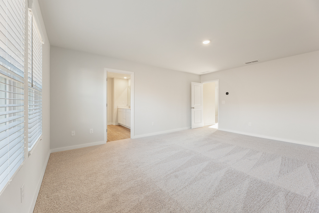 A long hallway with white walls.