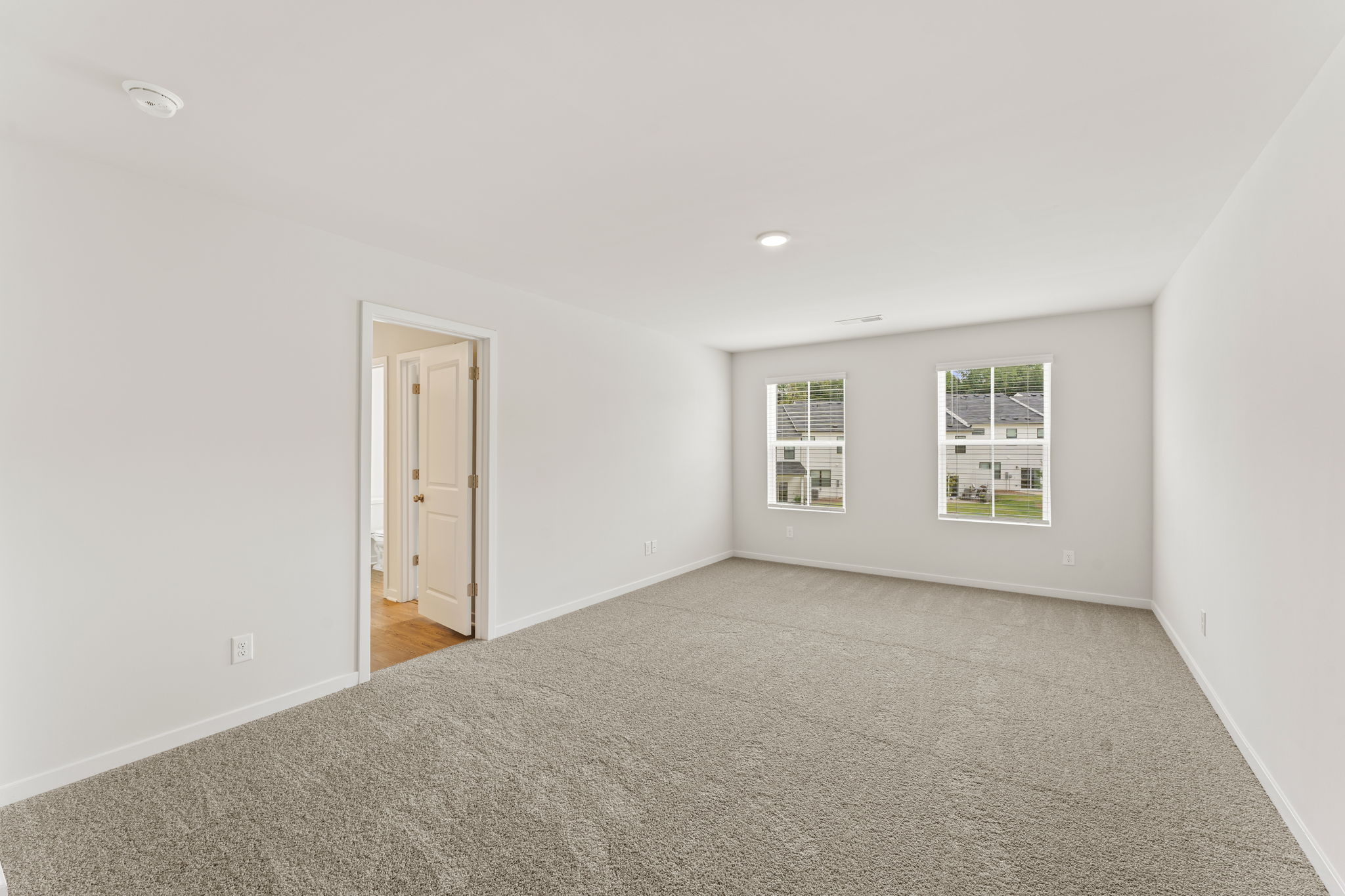 A room with a door and windows.