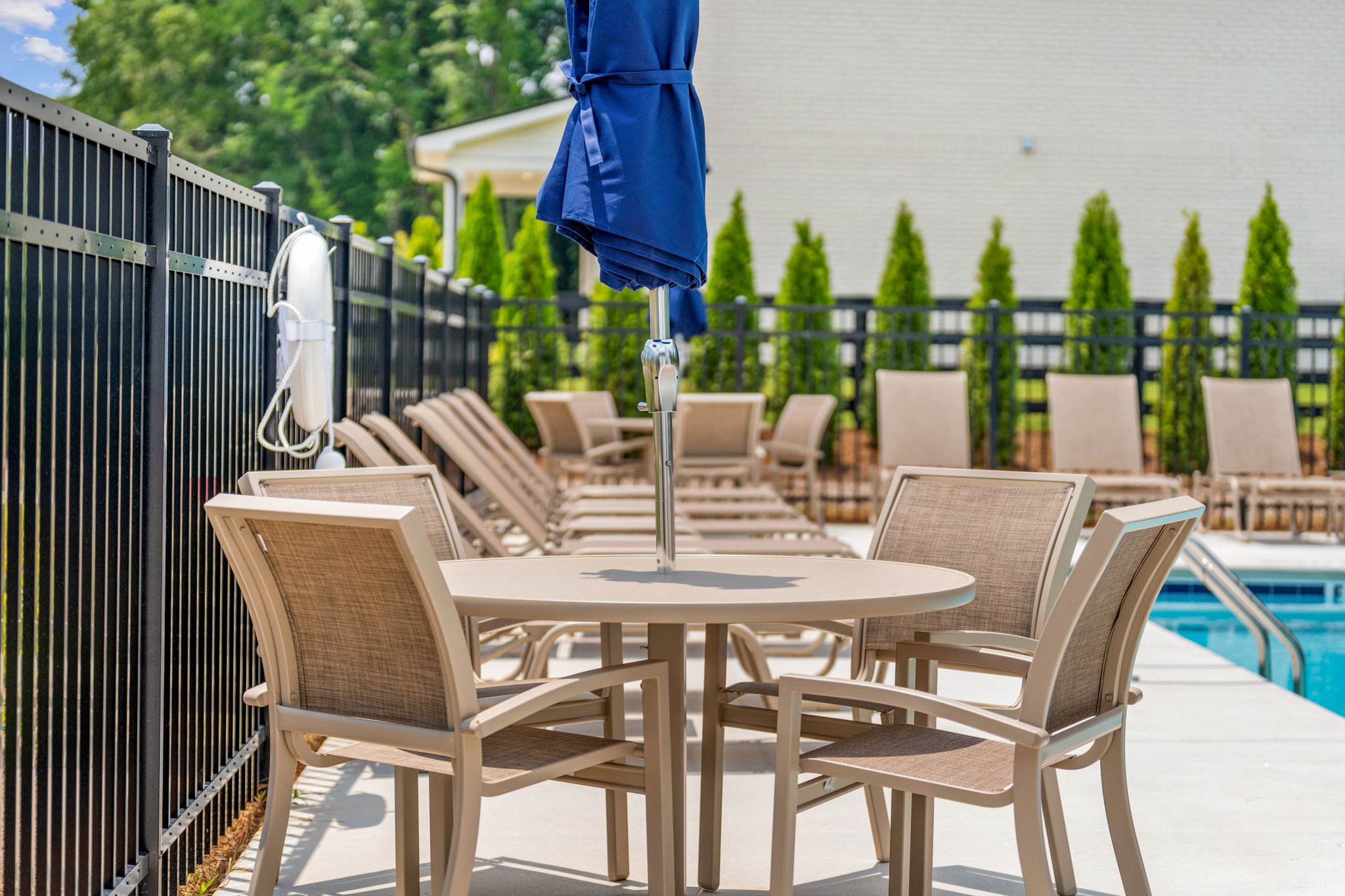 A table and chairs on a deck.