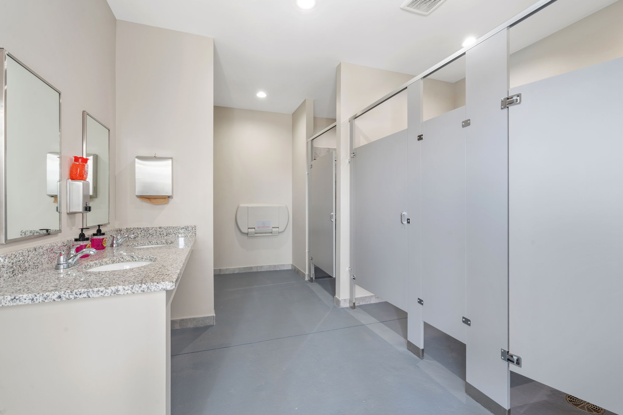 A bathroom with a sink and shower.