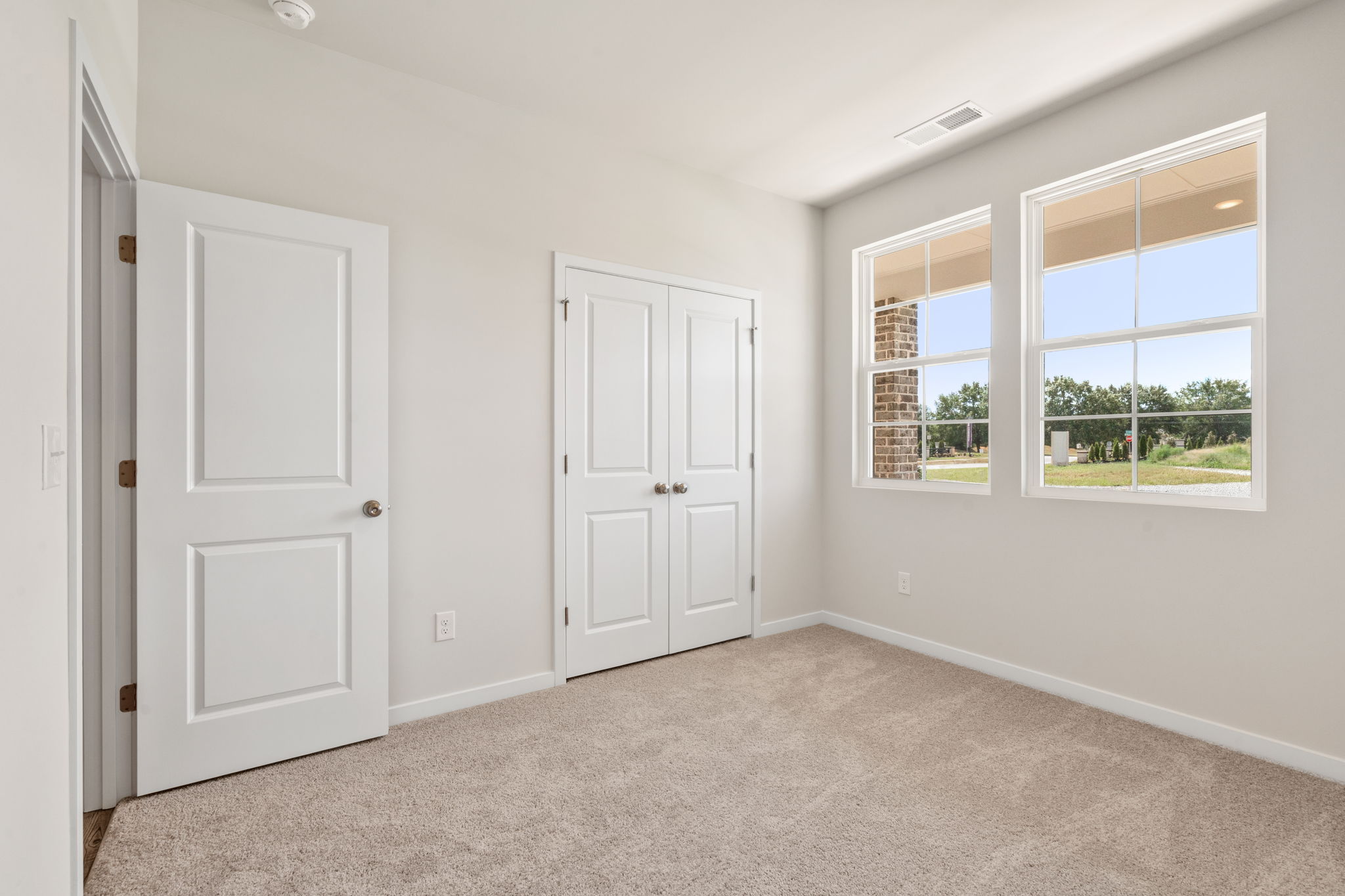A room with white doors and windows.