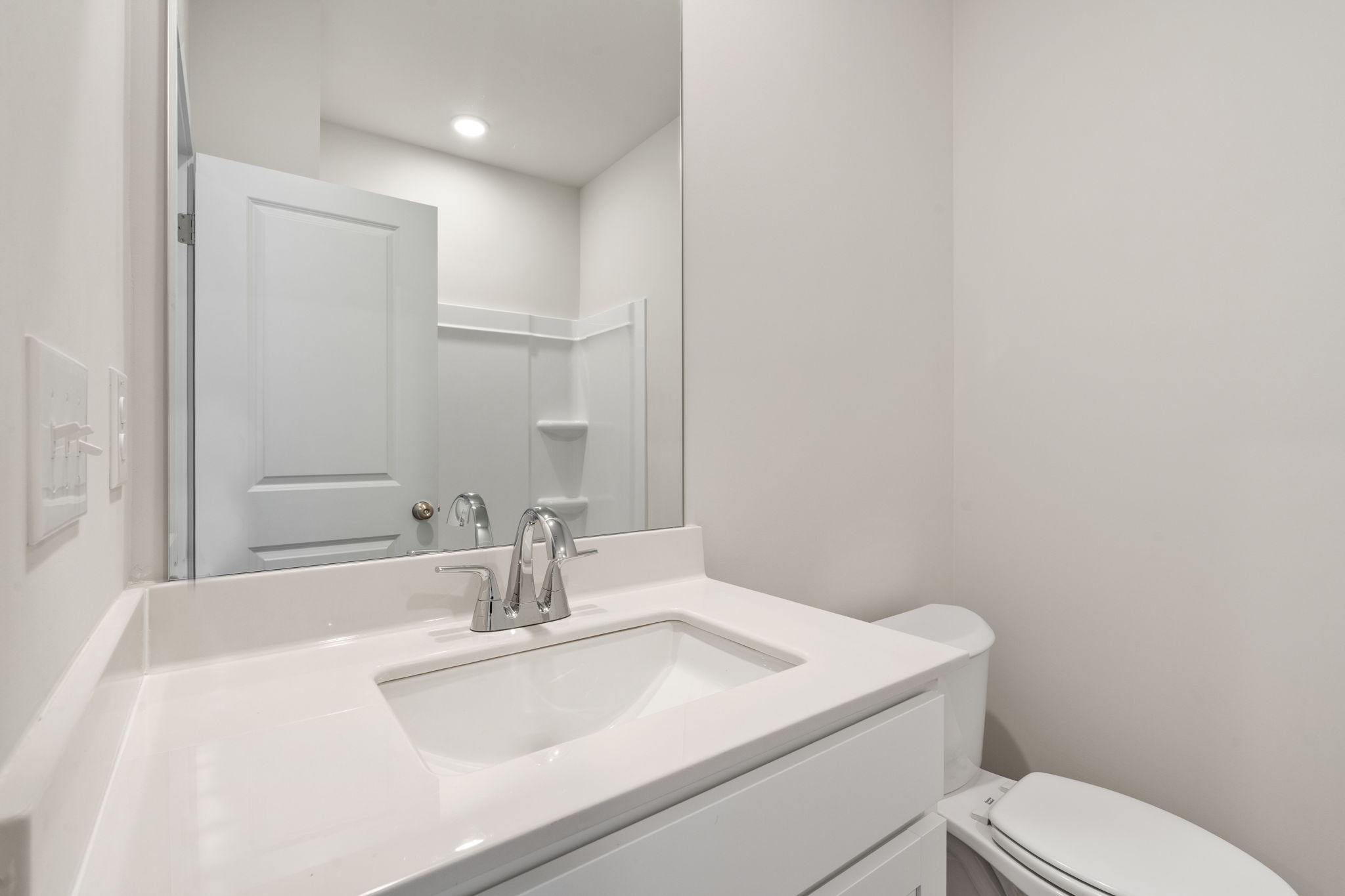 A bathroom with a sink and toilet.