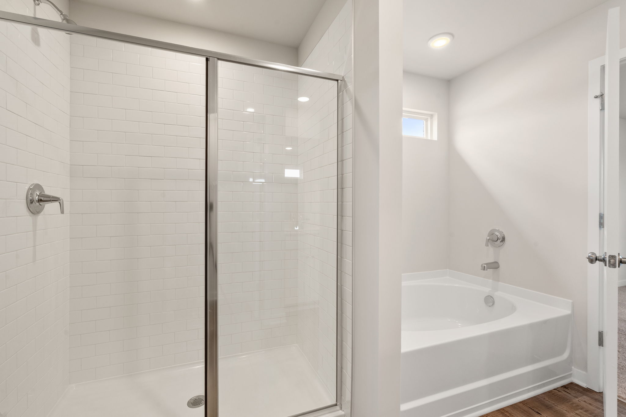 A bathroom with a glass shower.