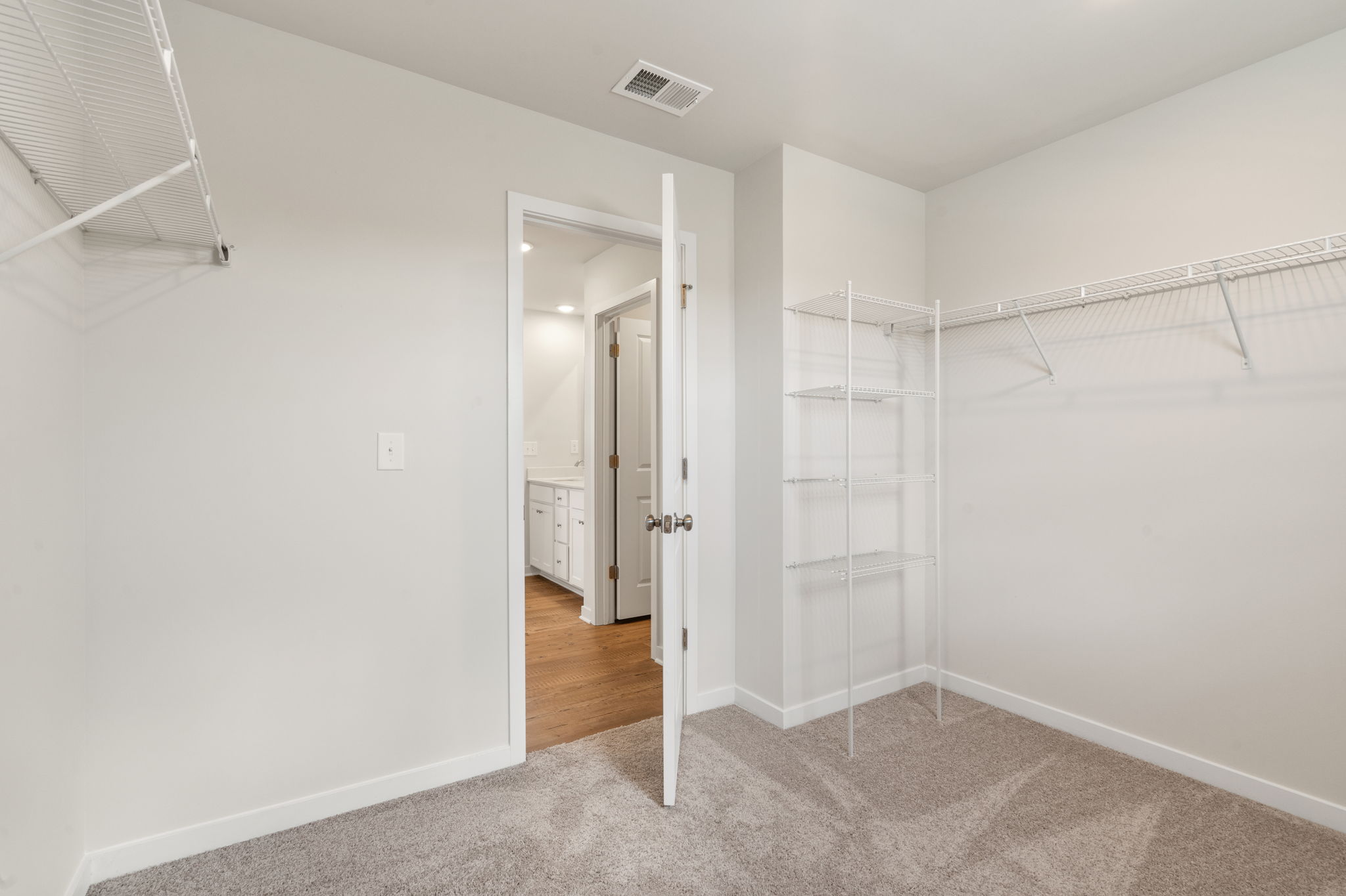 A hallway with white walls.