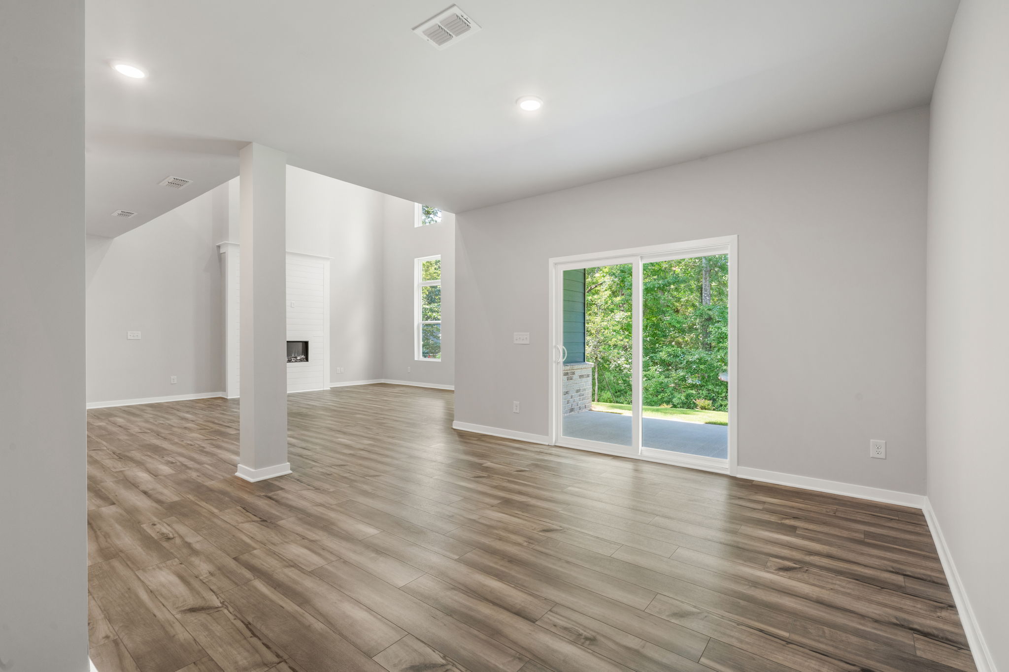A room with a wood floor and a wood floor.