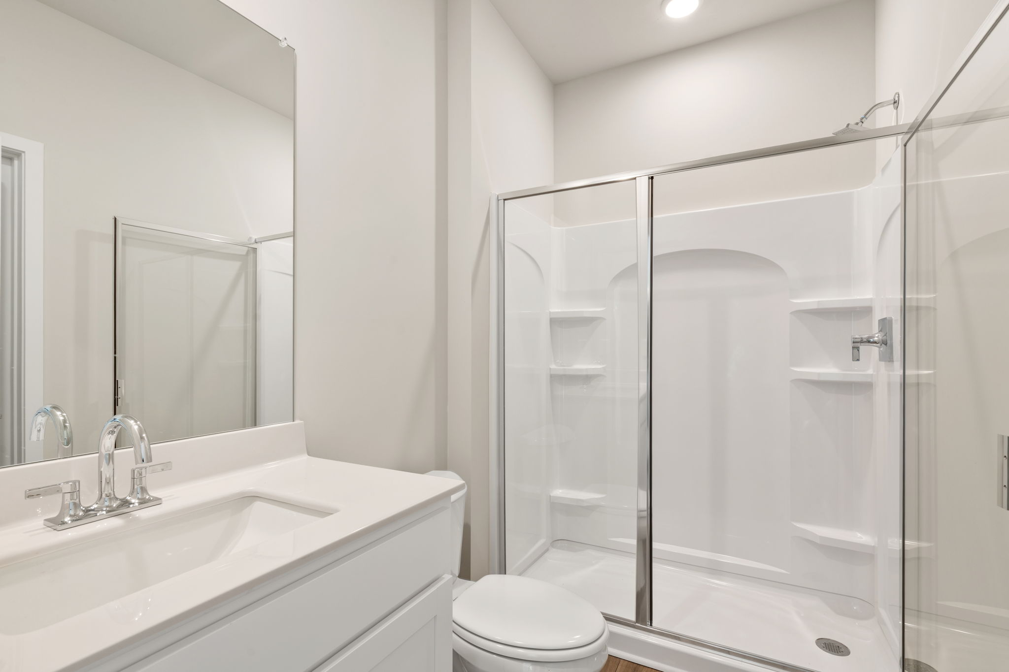 A bathroom with a glass shower.