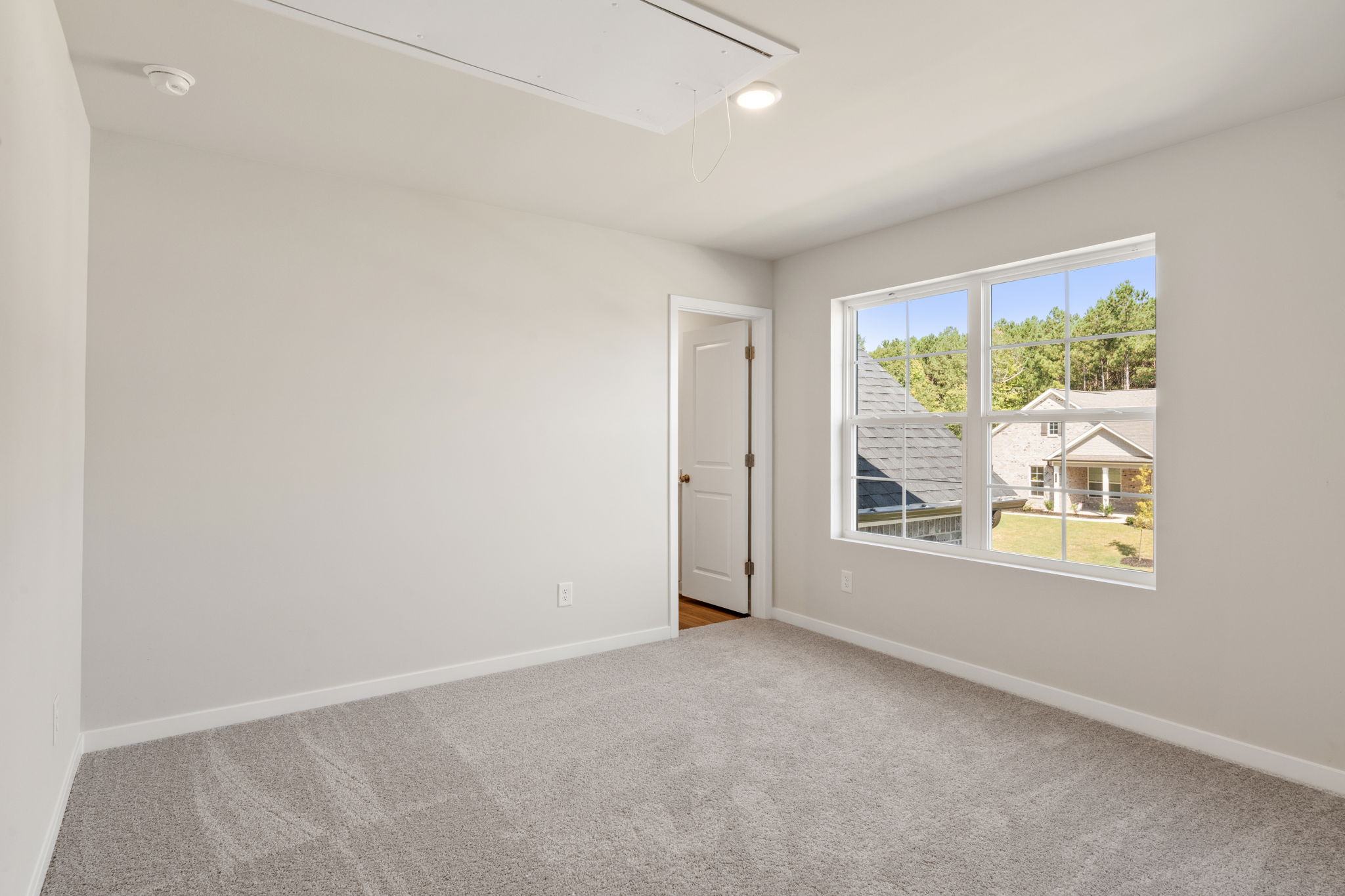 A room with a door and a window.