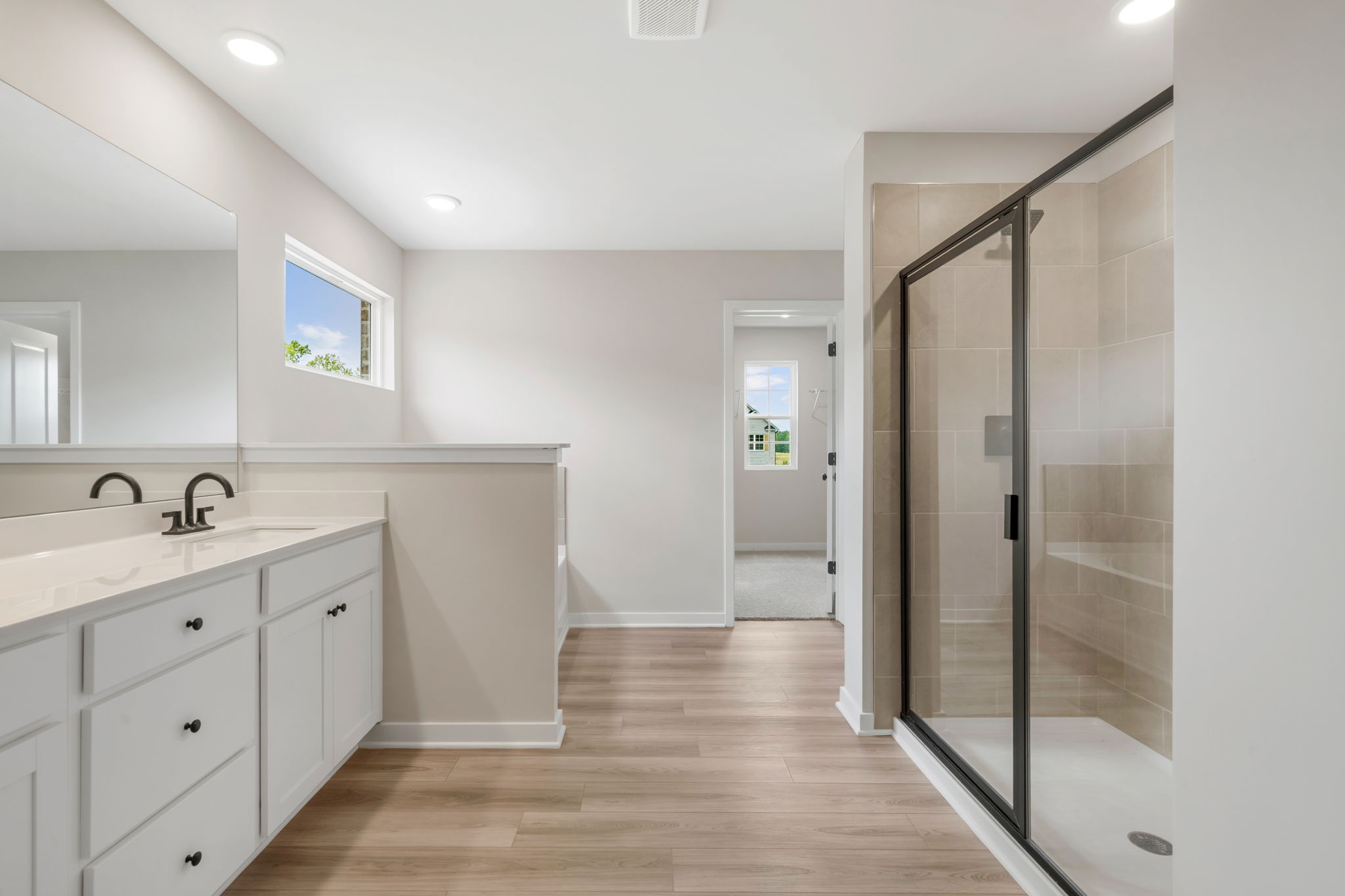 A bathroom with a glass shower.
