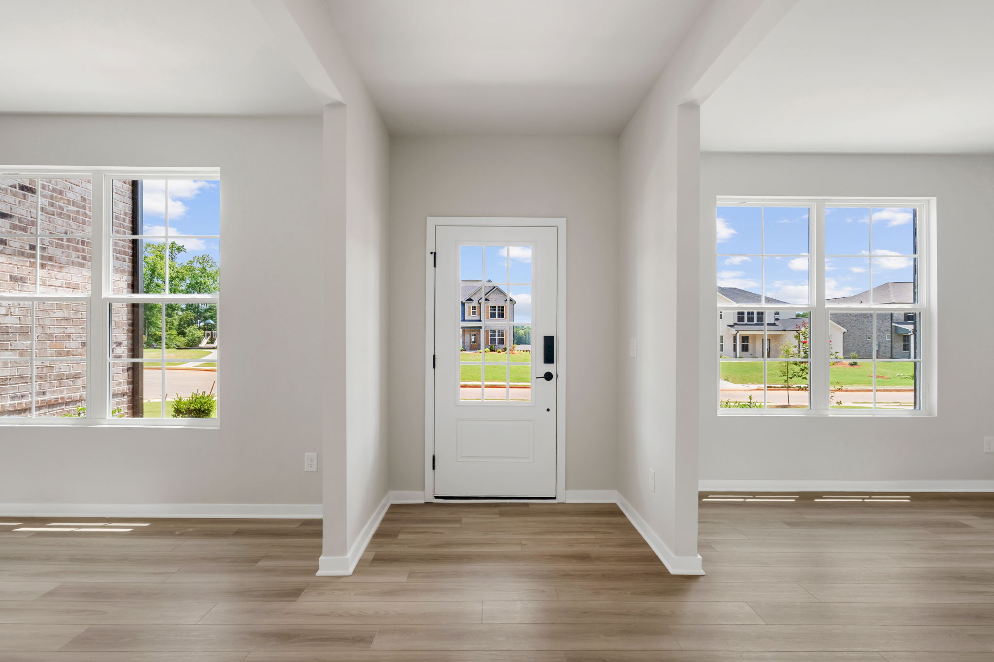 A room with a door and windows.