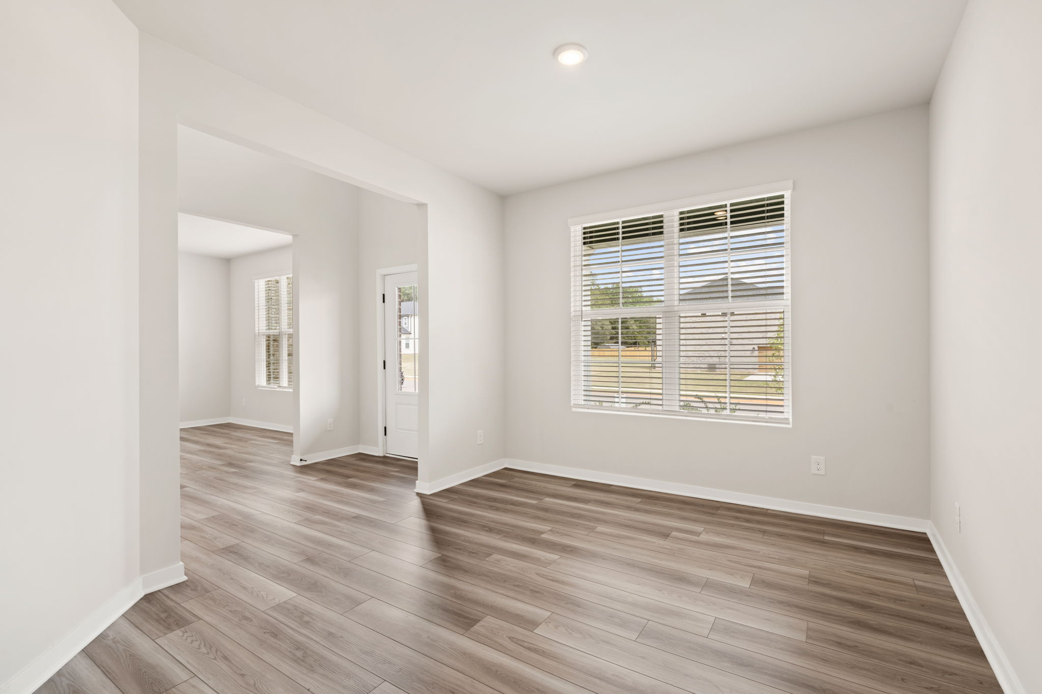 A room with a wood floor and a wood floor.