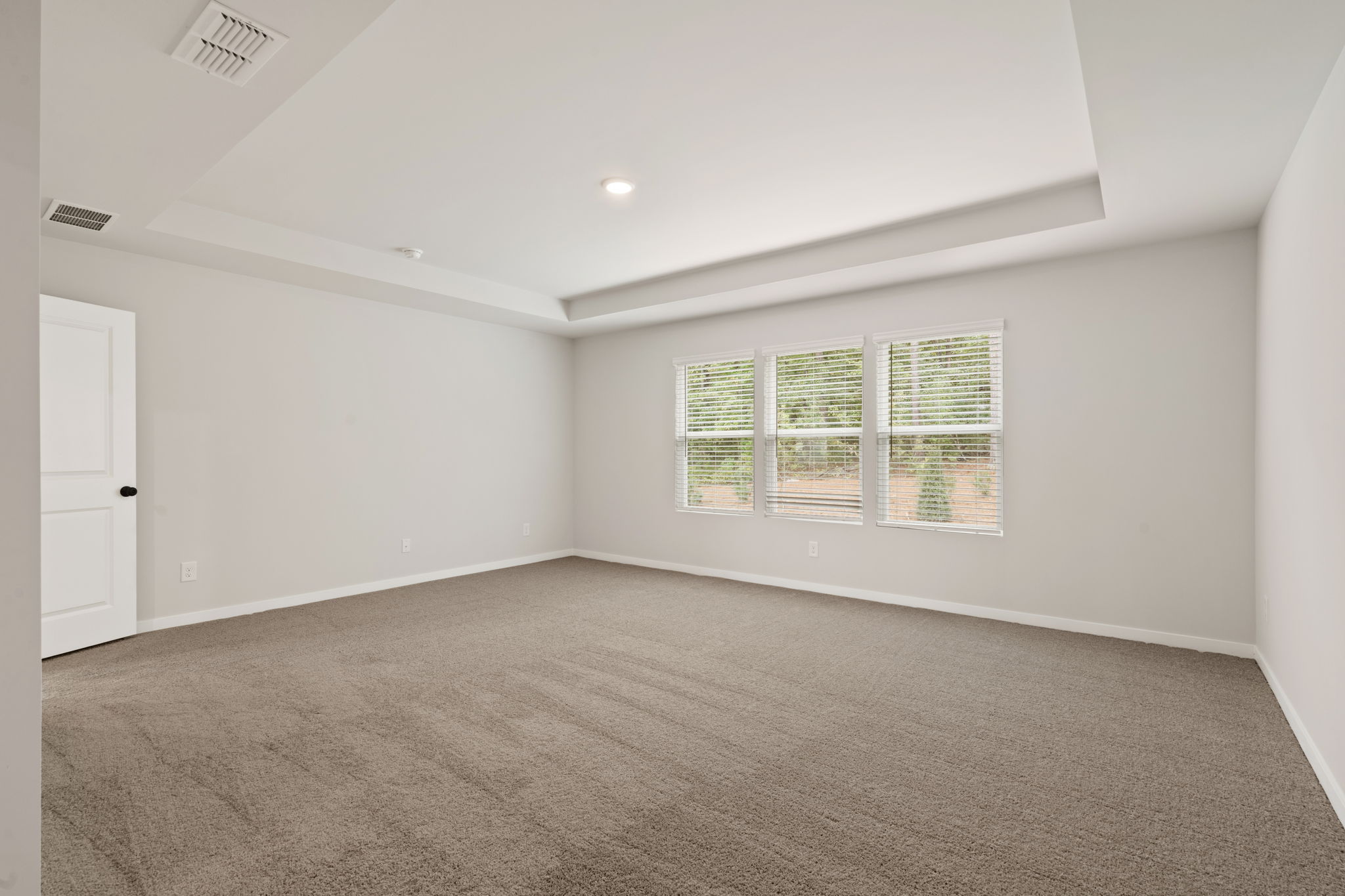 A room with a door and windows.