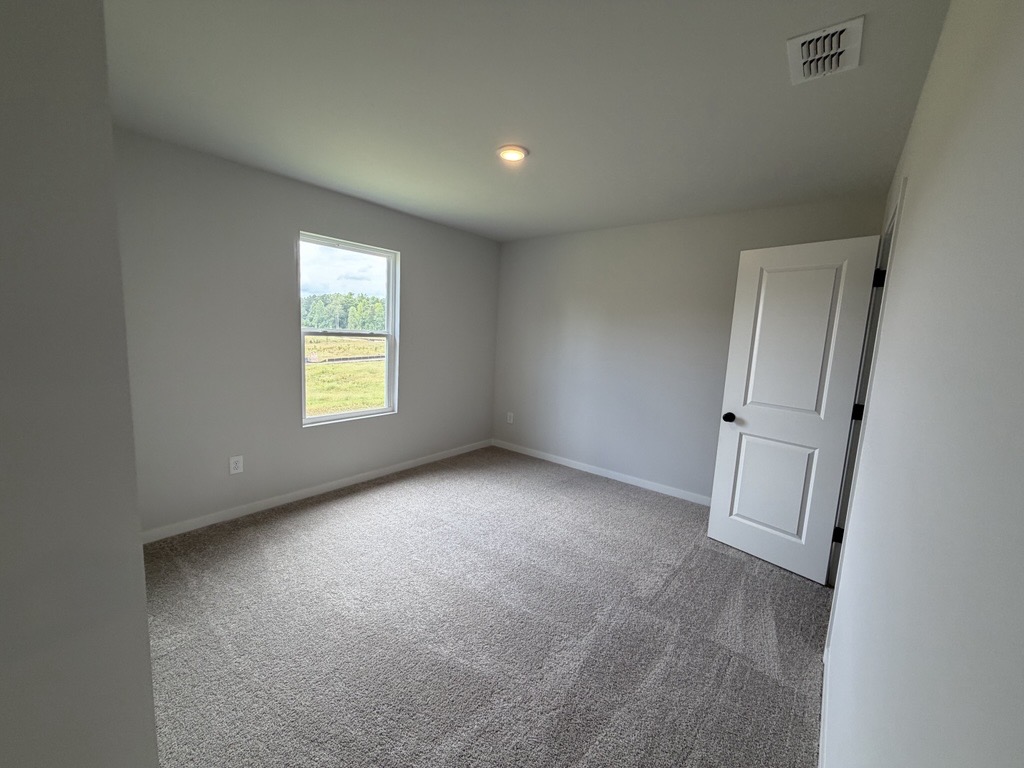 A room with a door and a window.