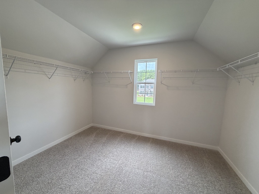 A room with a window and a door.