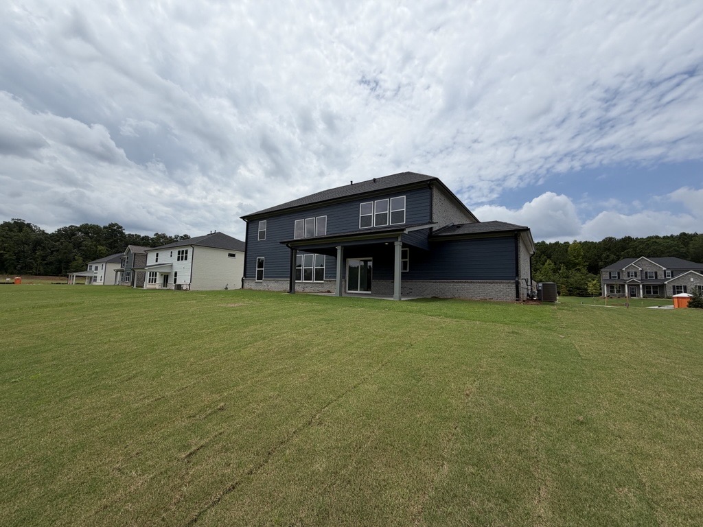 A house with a grass yard.
