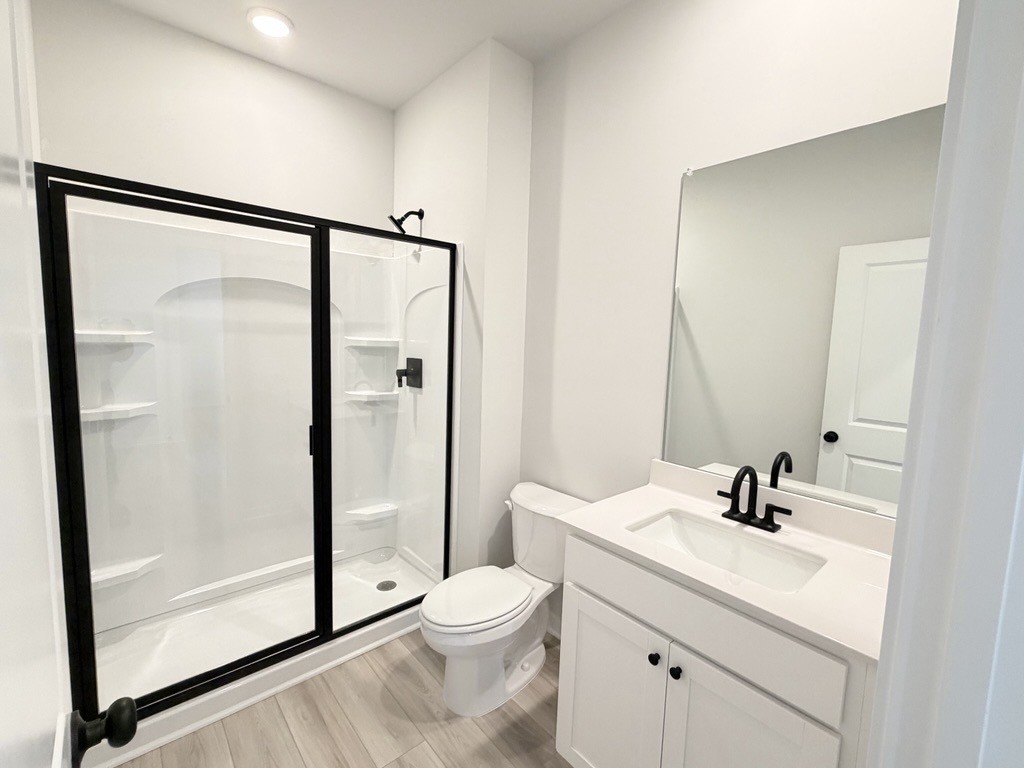 A bathroom with a glass shower.