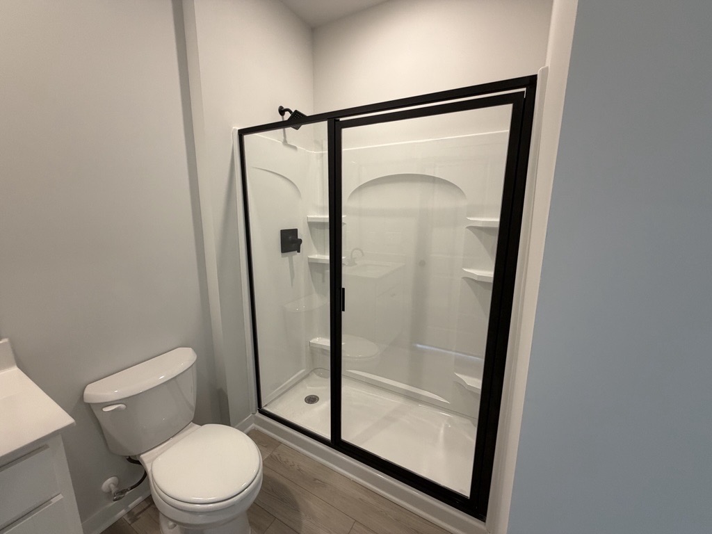 A bathroom with a glass shower.