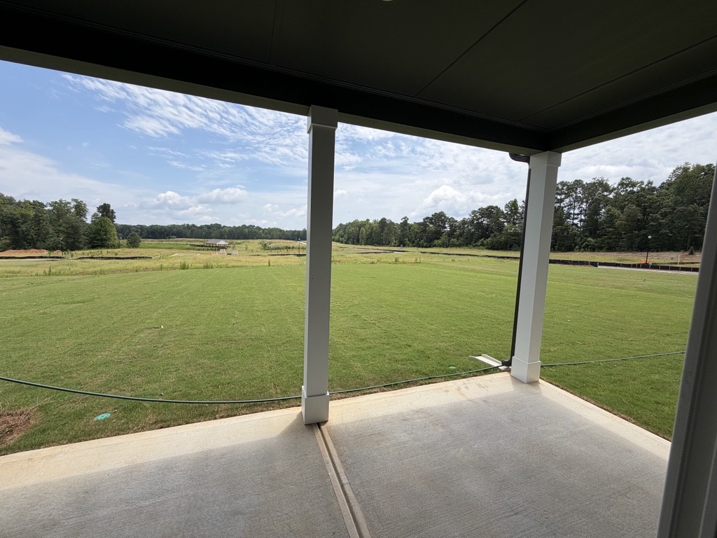 A view of a field through a window.