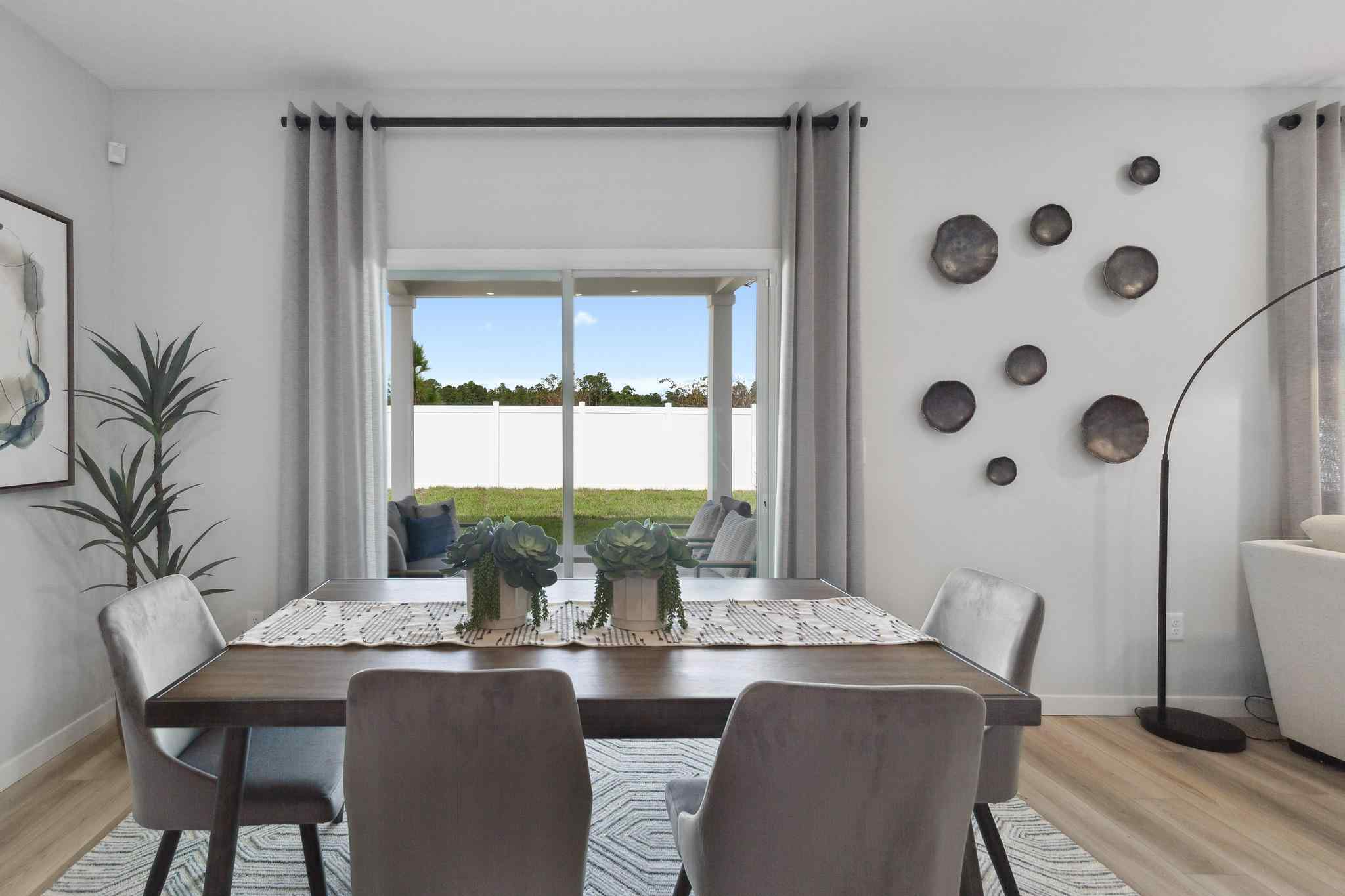 A dining room with a large window.