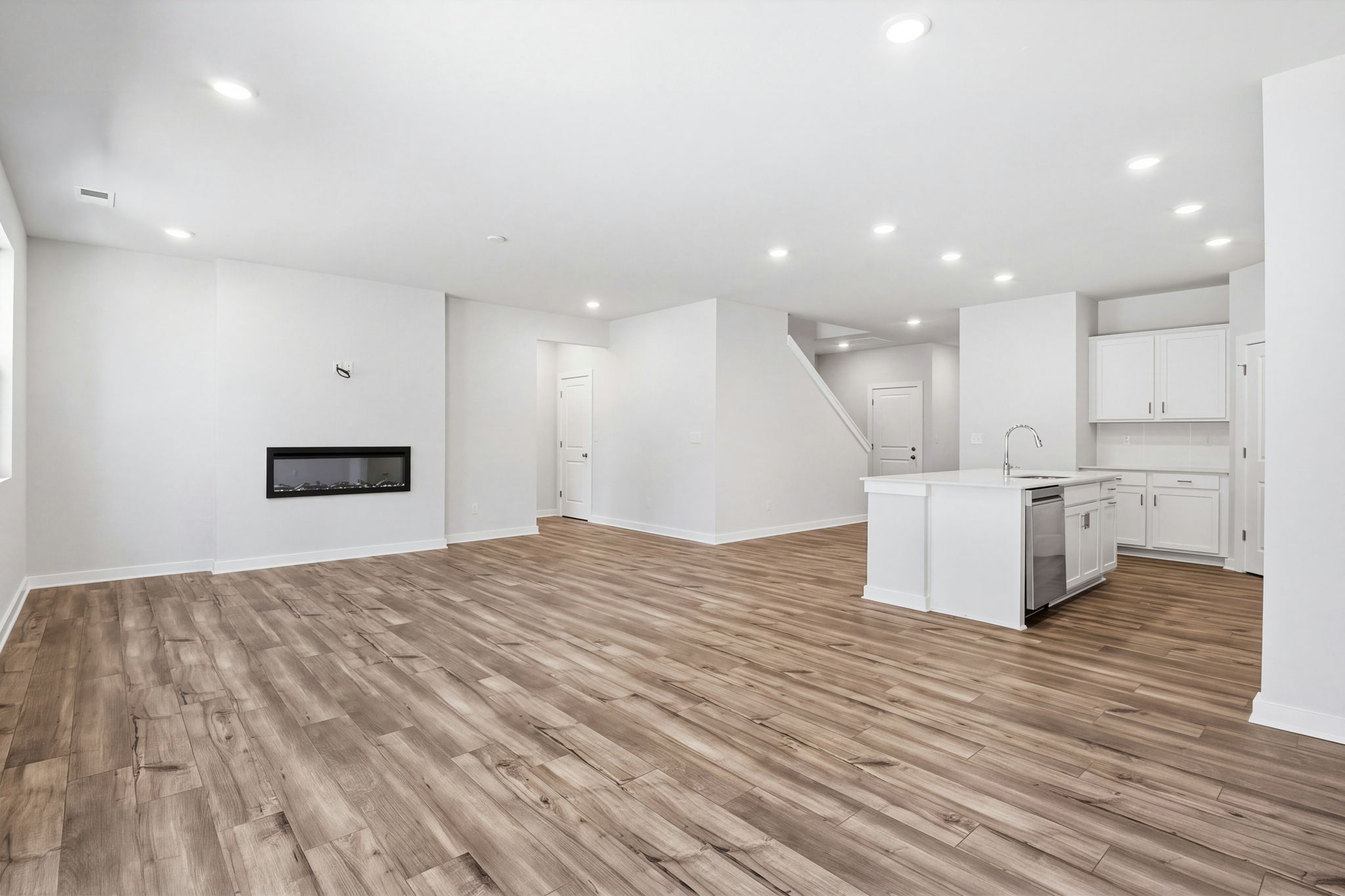 A large kitchen with white cabinets.