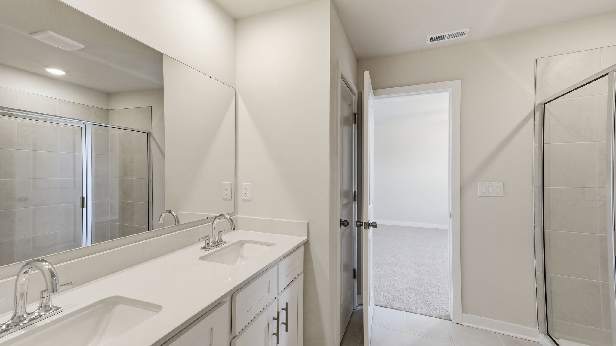 A bathroom with a glass shower.
