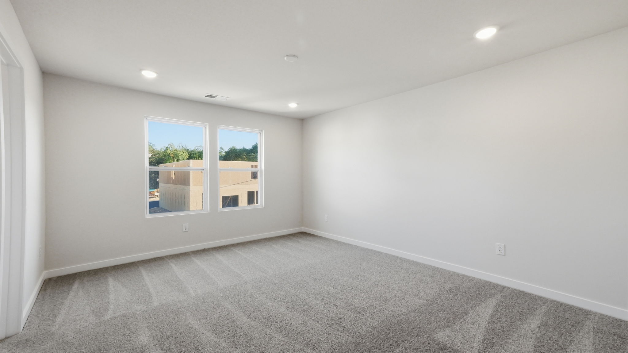 A room with a window and a door.