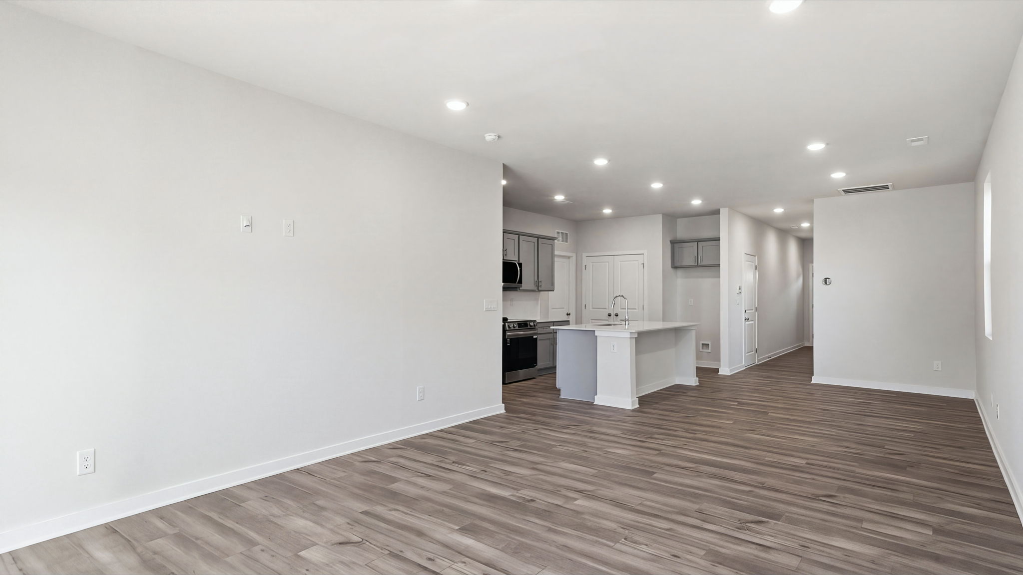 A kitchen with white walls.