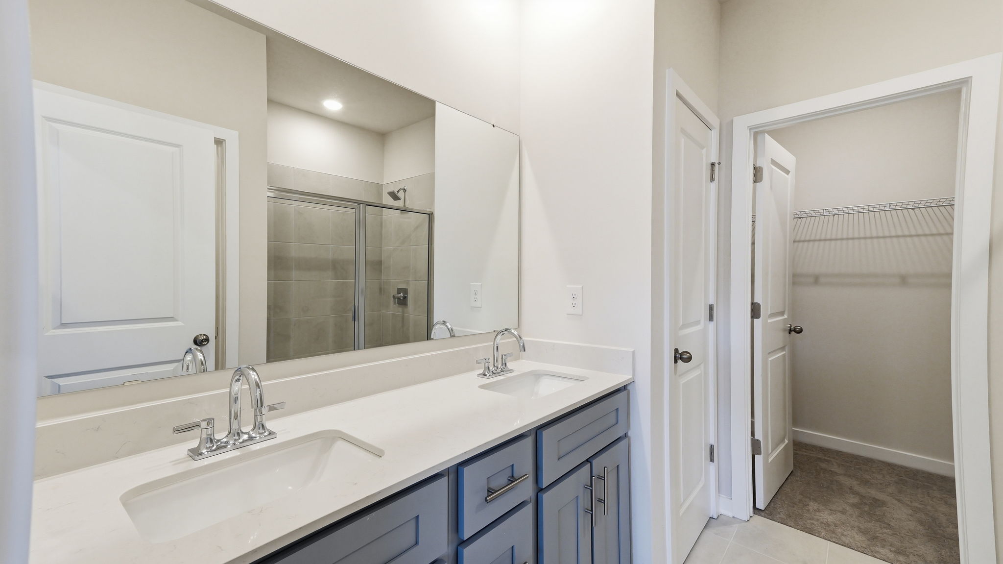 A bathroom with a glass shower.