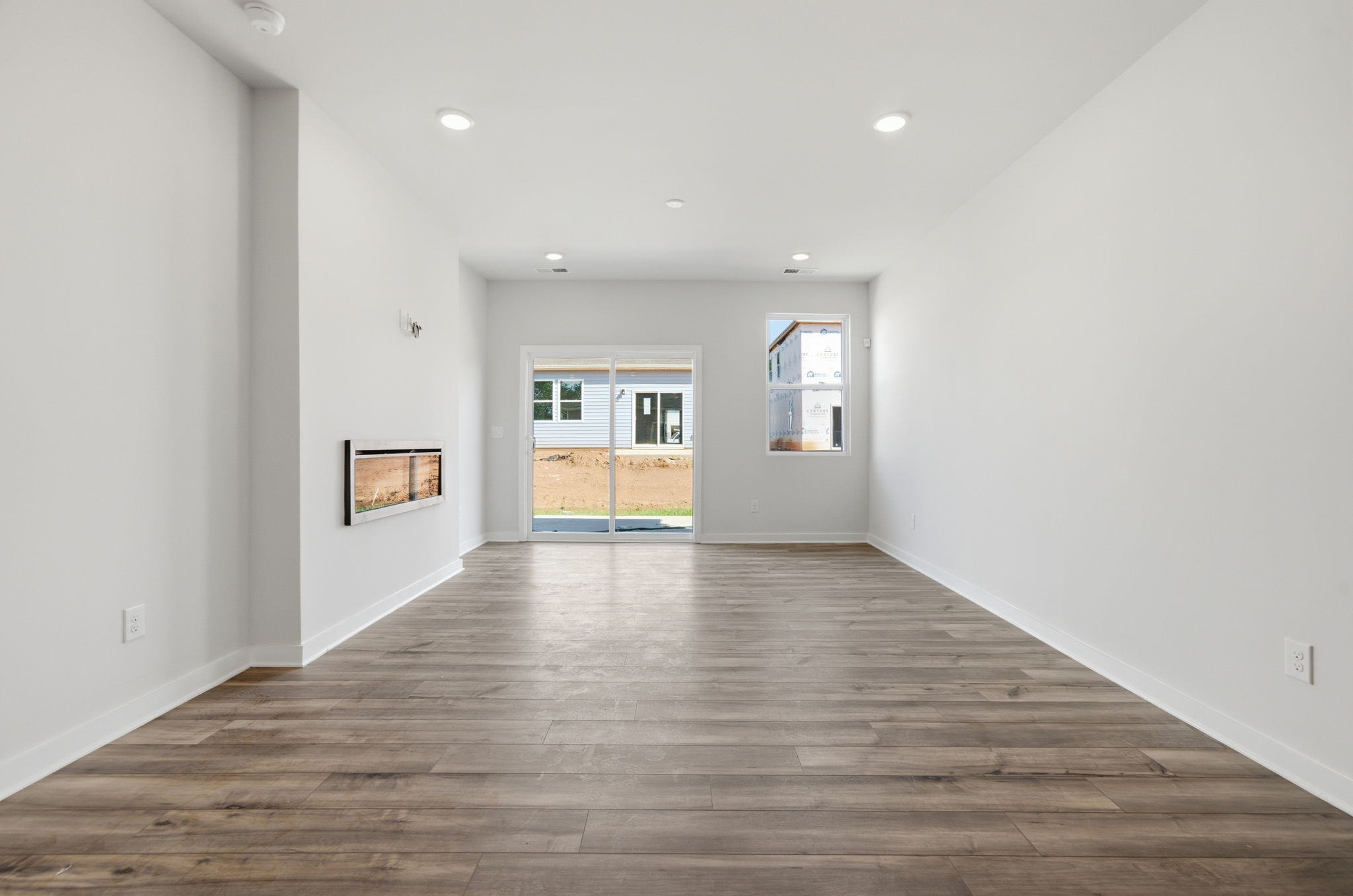 A room with a wood floor and a wood floor.