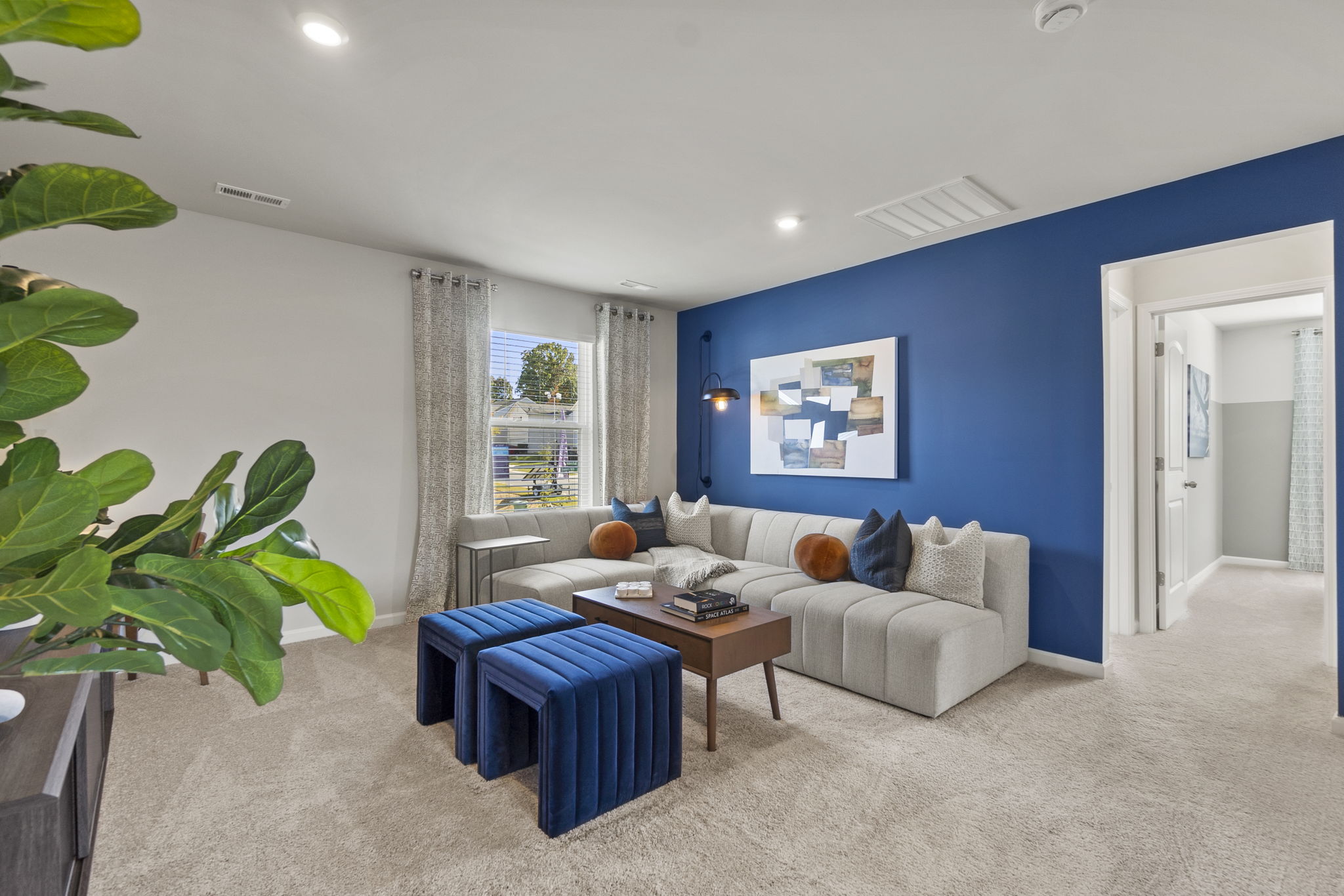 A living room with a couch and a coffee table.