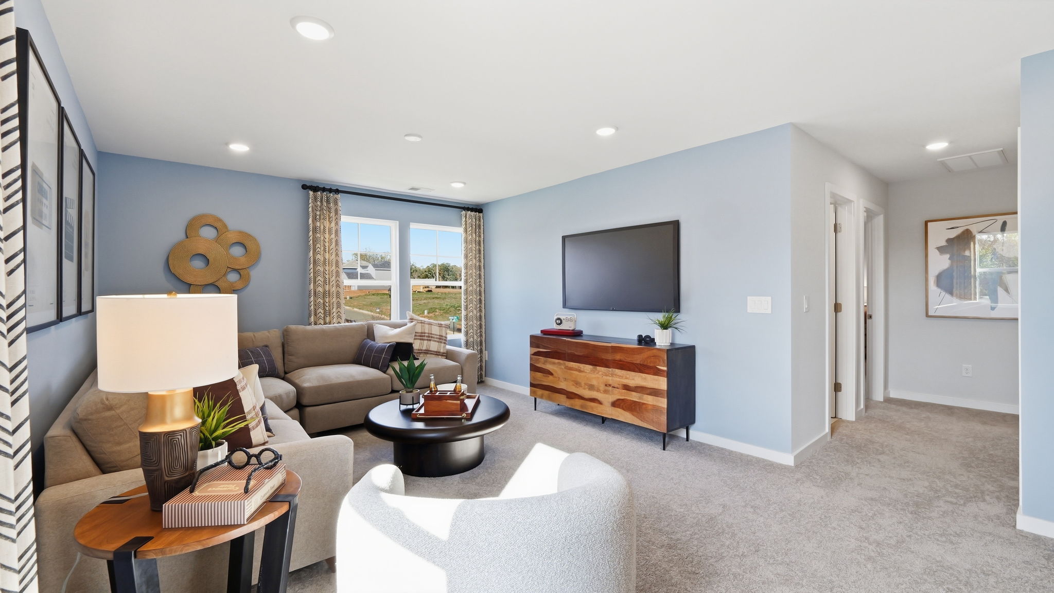 A living room with a tv and couches.