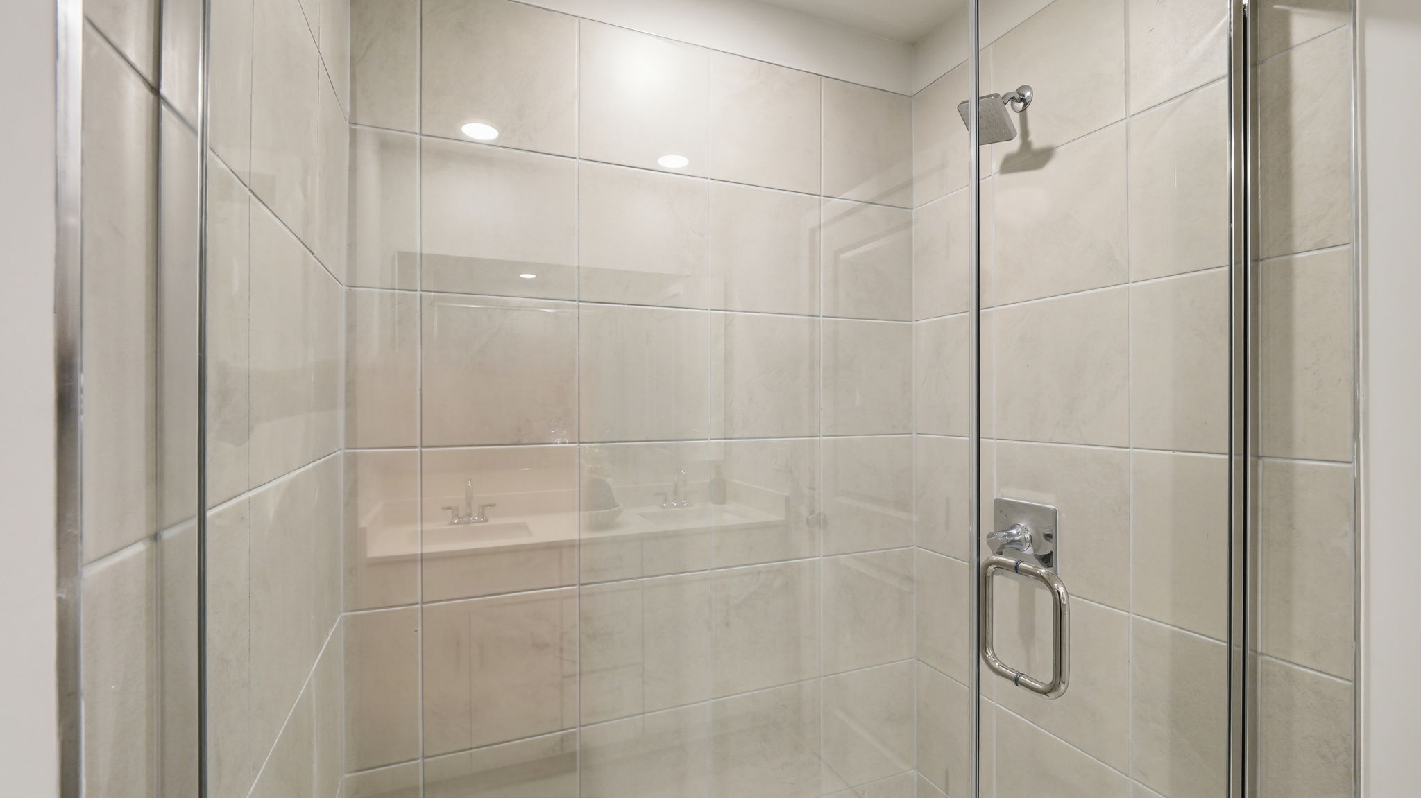 A bathroom with a glass shower.