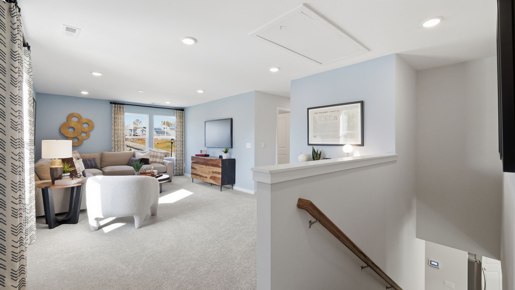 A living room with a staircase.