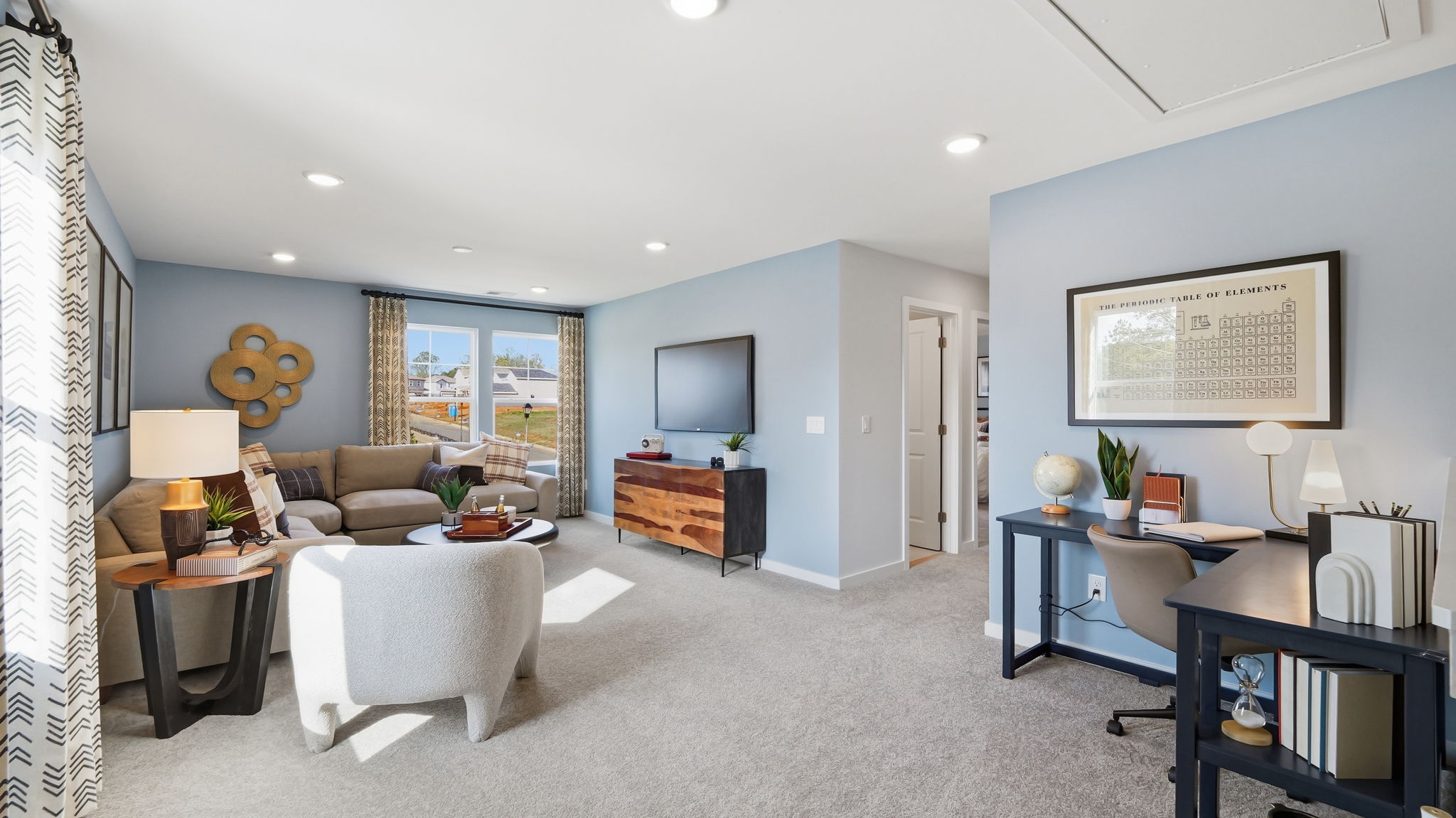 A living room with a tv and furniture.