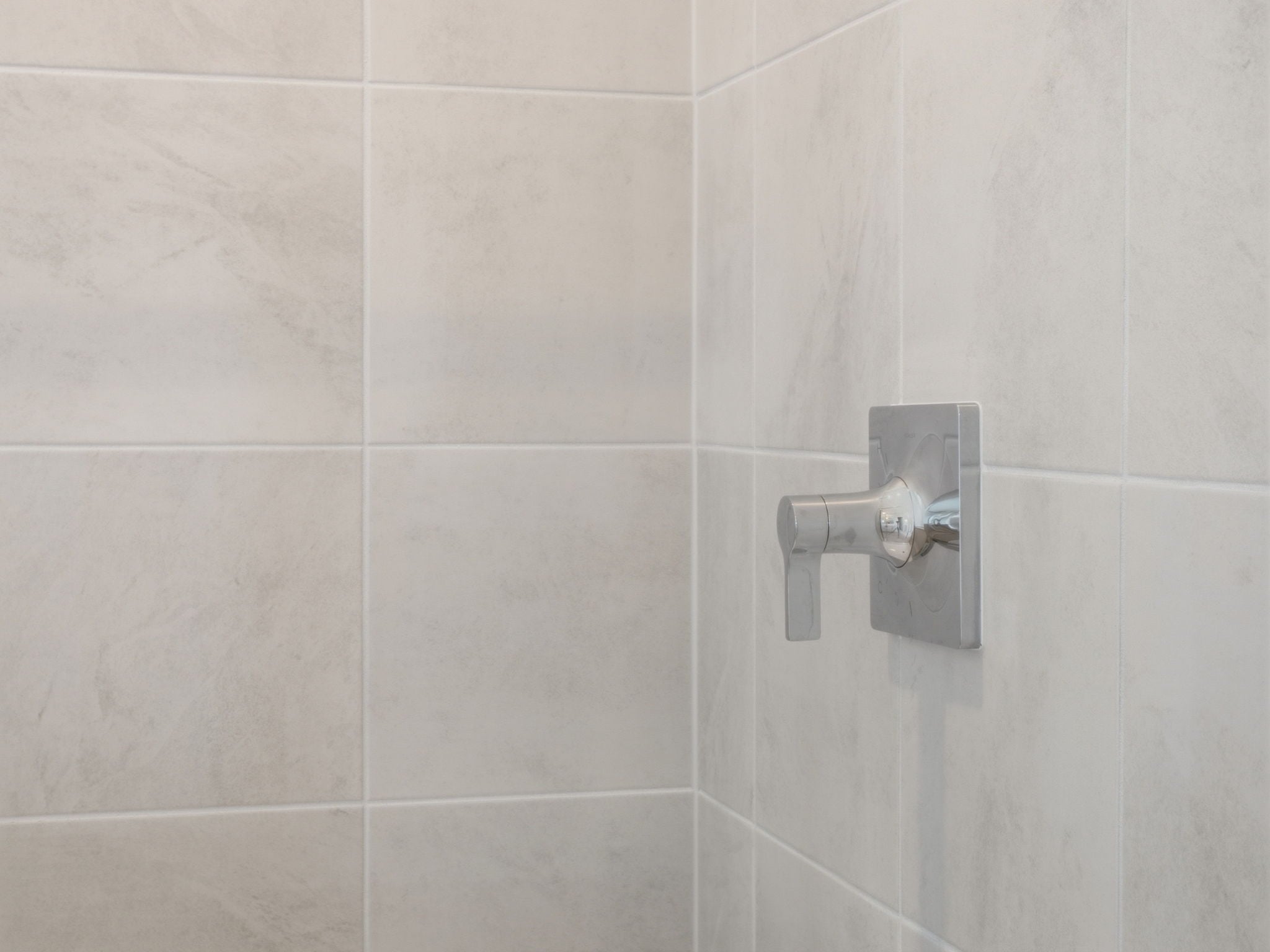 A white tiled wall.