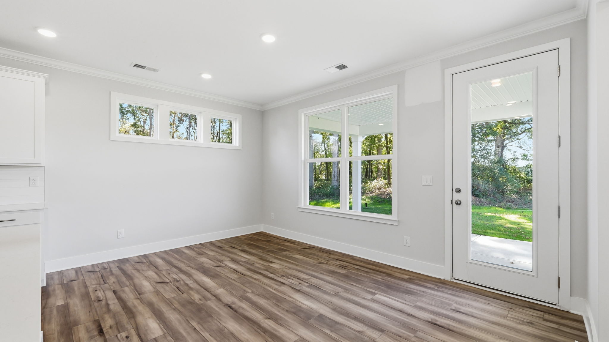 A room with white walls and windows.