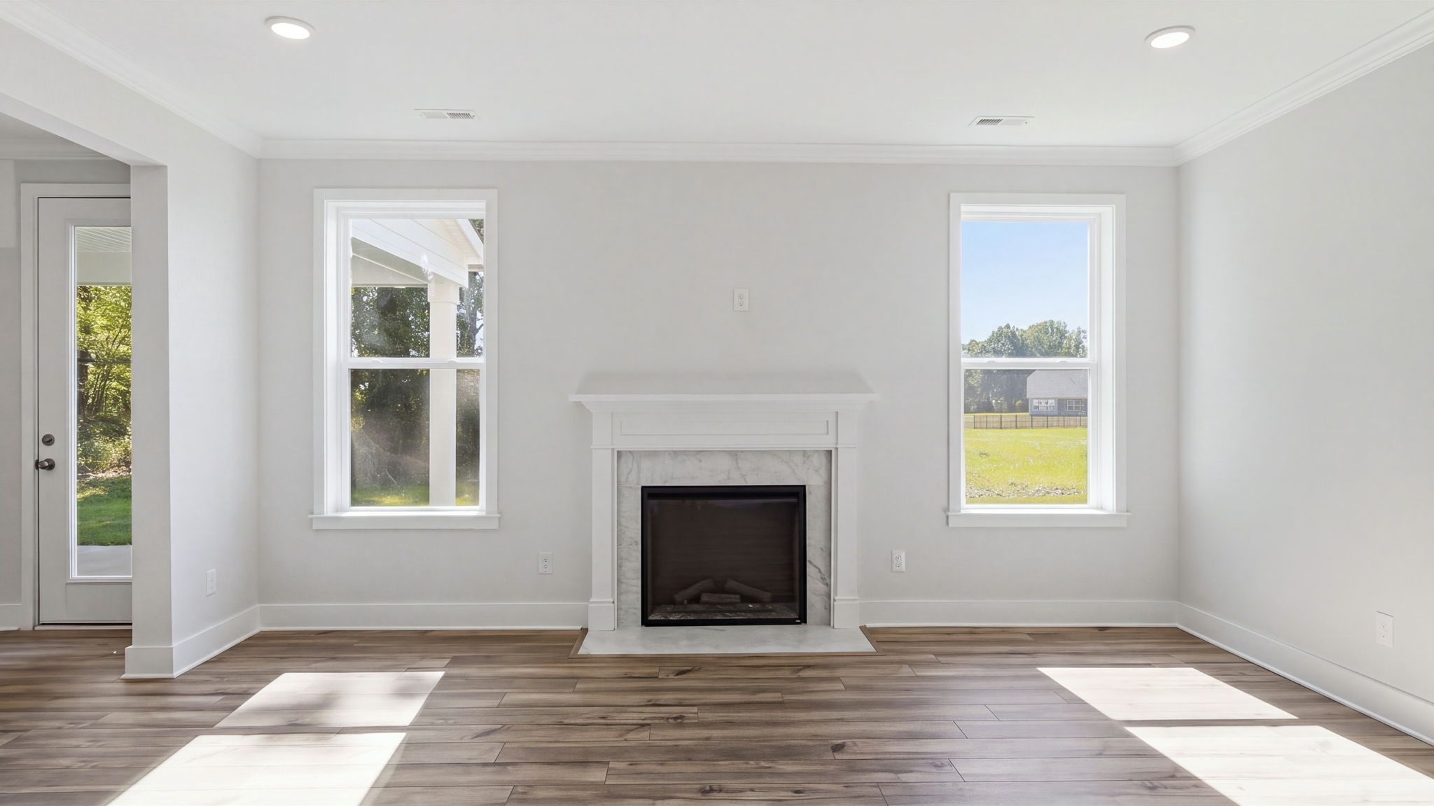 A room with a fireplace and windows.