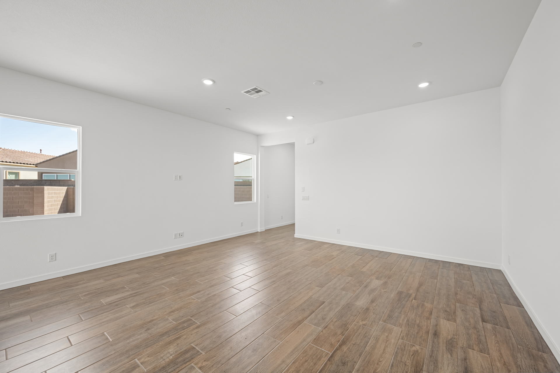 A room with a wood floor and a wood floor.