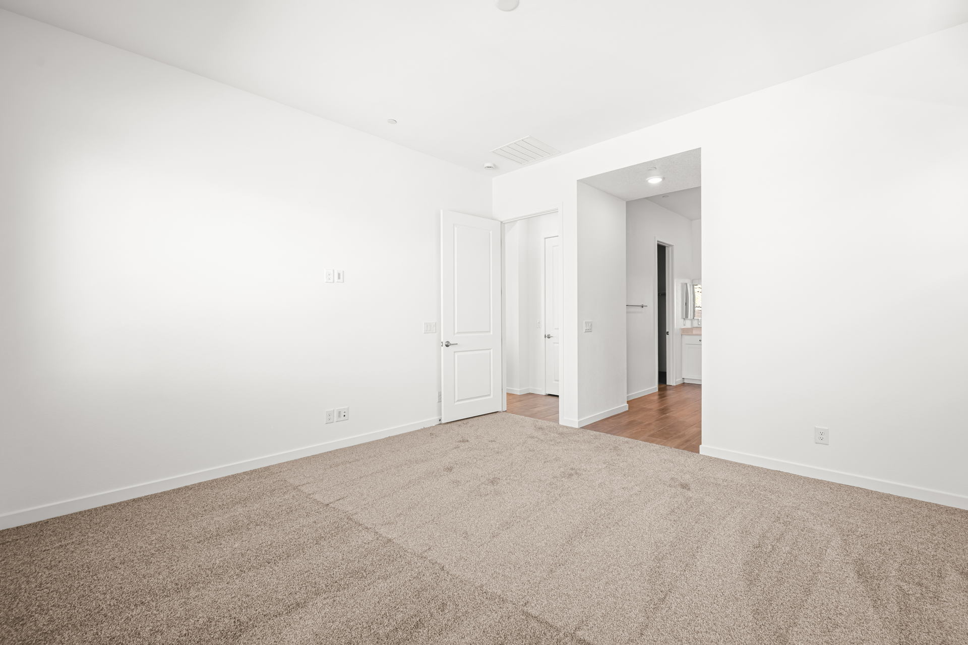 A hallway with white walls.
