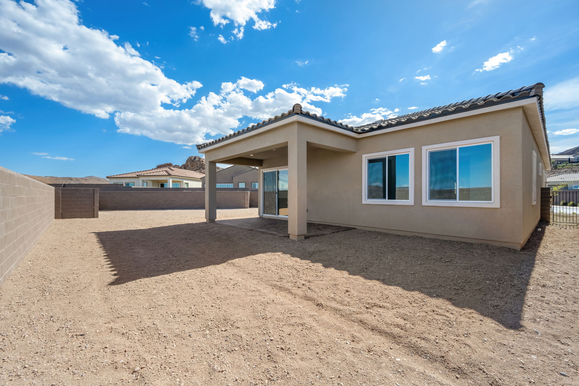 A house with a dirt yard.