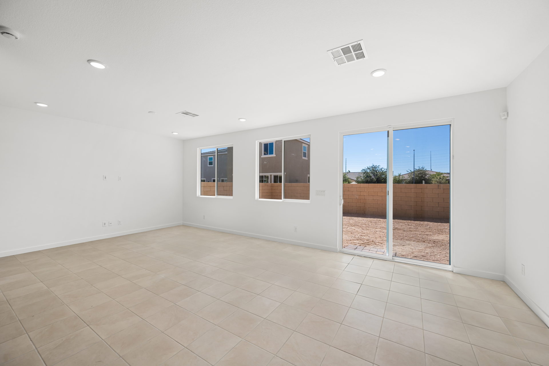 A room with a large glass door.