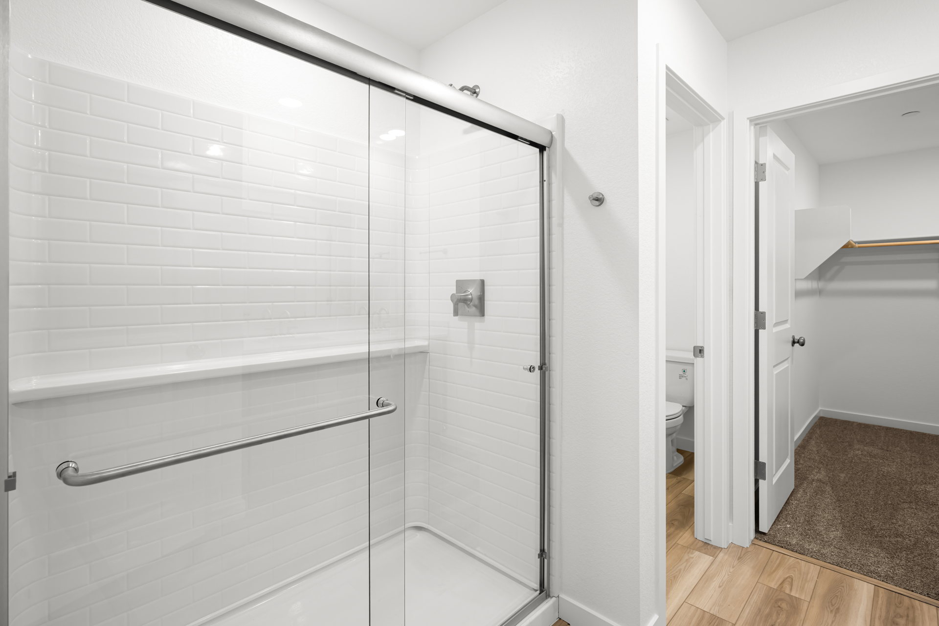 A bathroom with a glass shower.