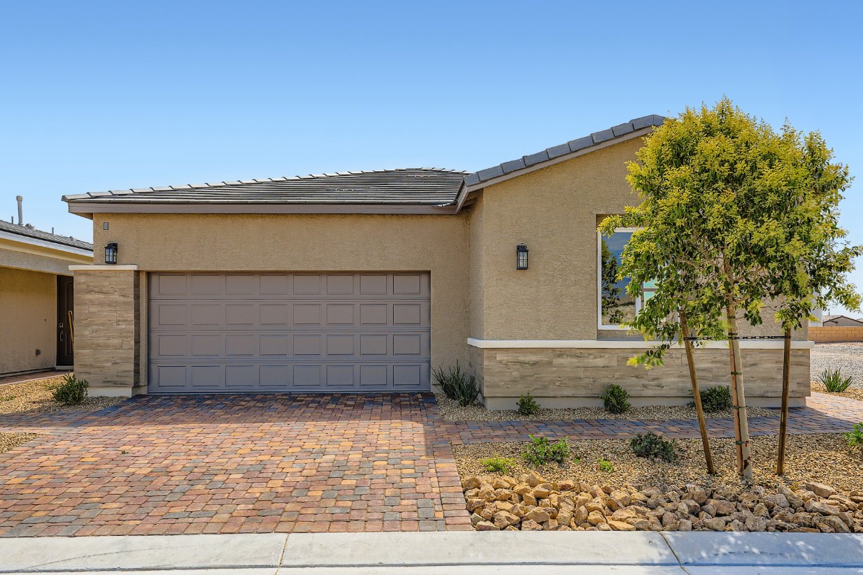 A building with a brick driveway.