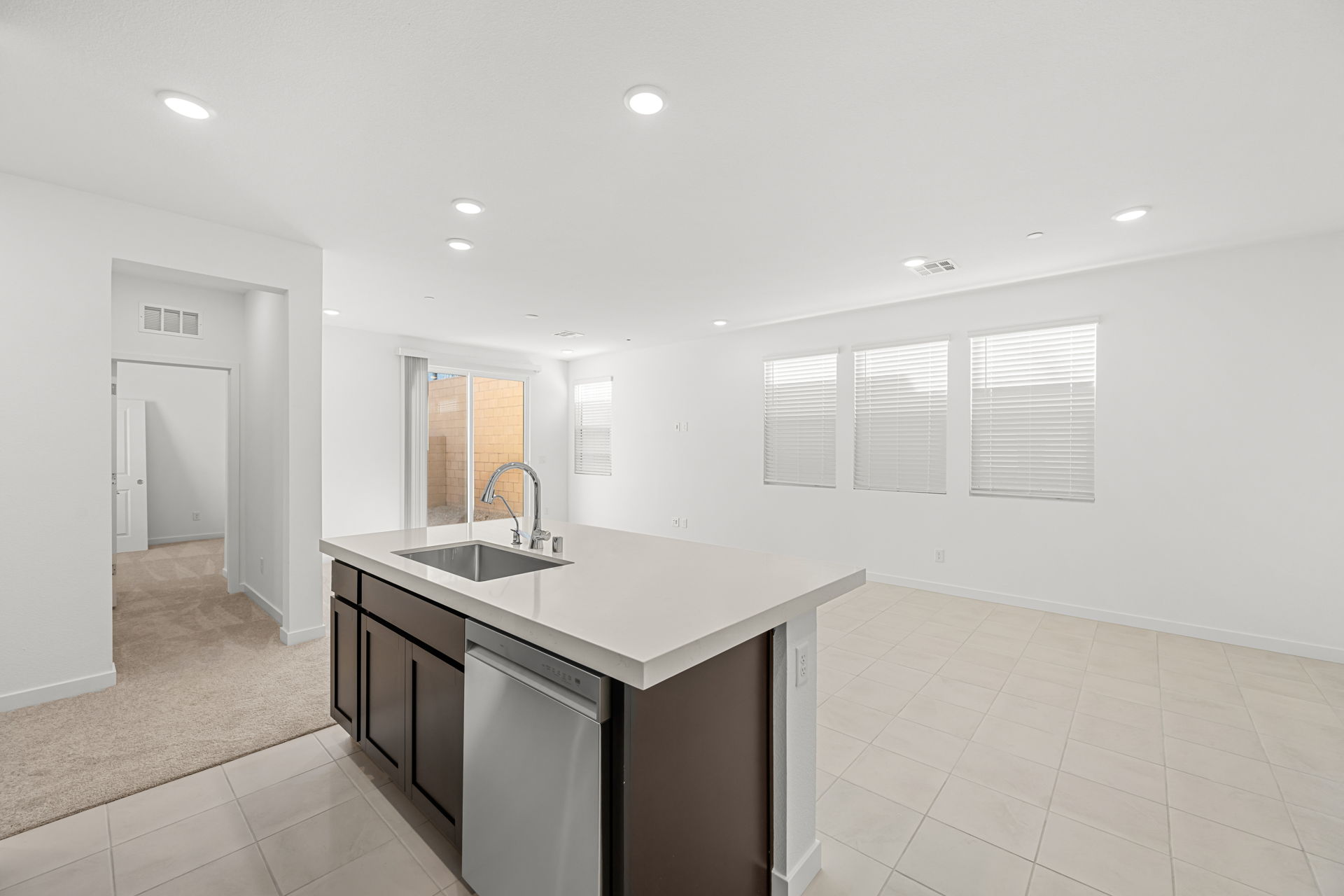 A kitchen with a sink and cabinets.