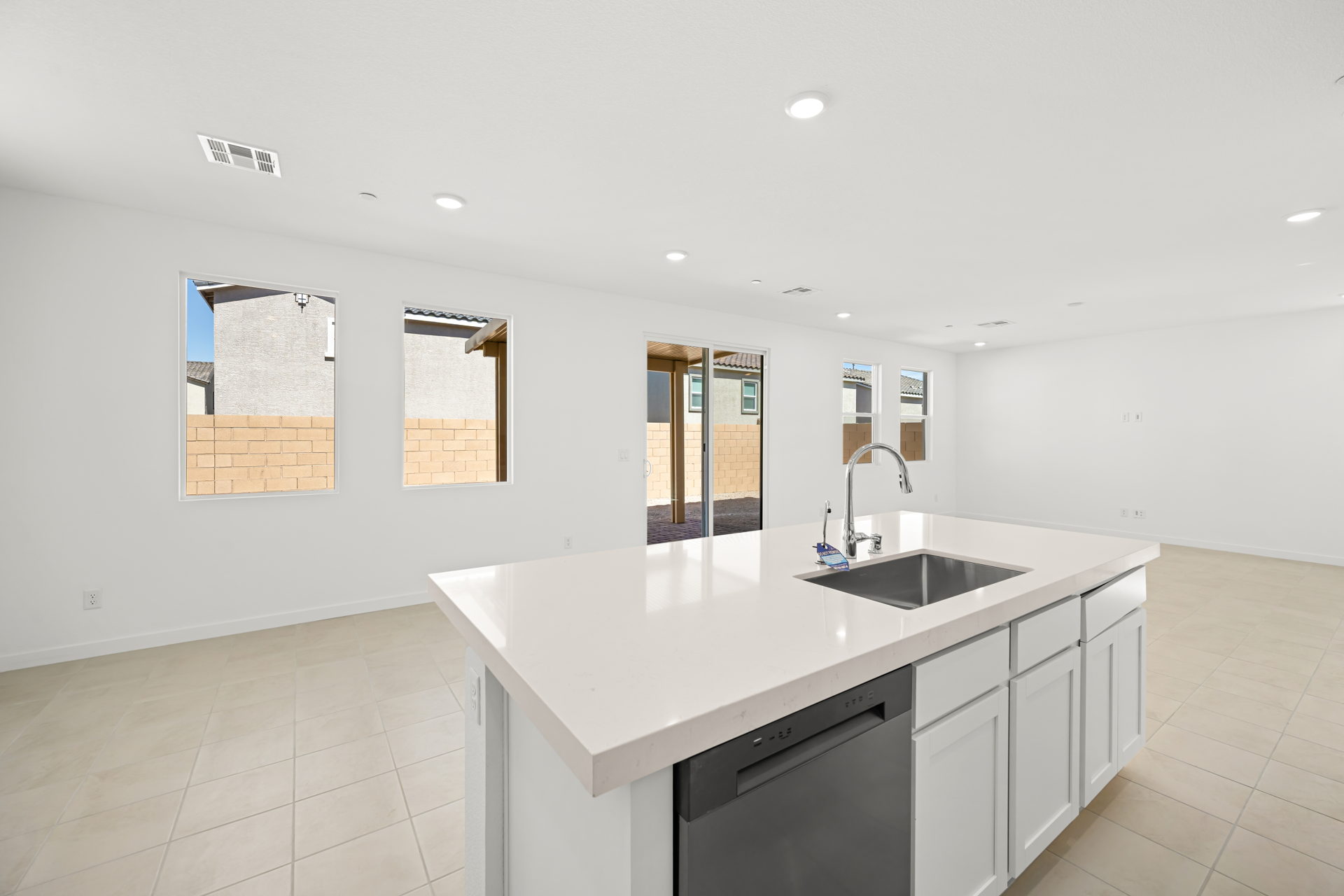 A bathroom with a sink and cabinets.